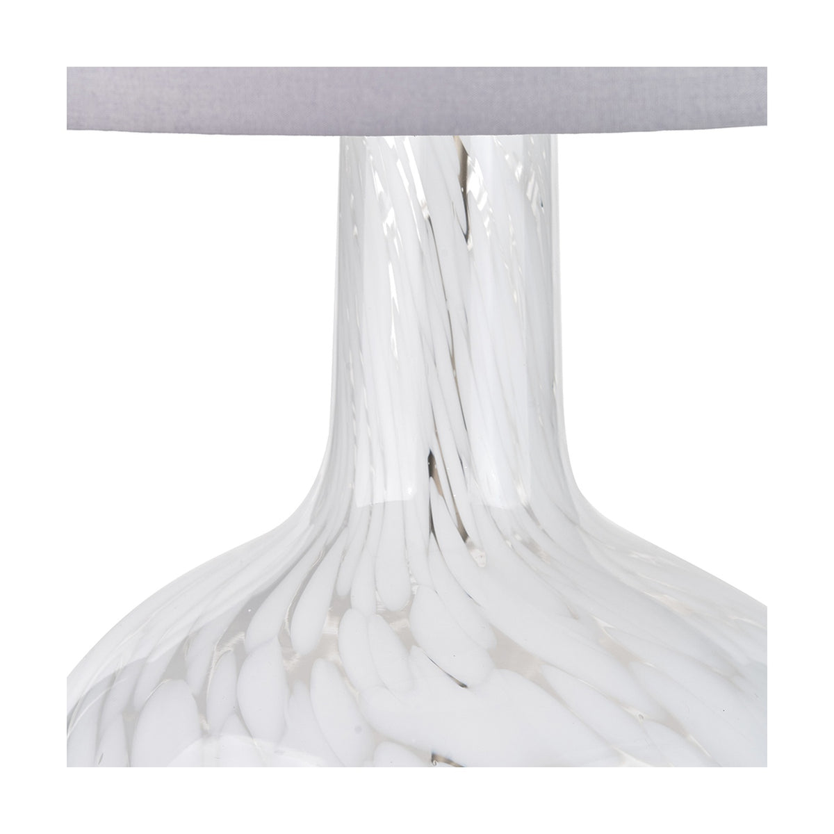 Close-up of the Aurora Speckled White Glass Table Lamp, 58cm, showing the swirled white glass base and neck beneath a light grey fabric shade.