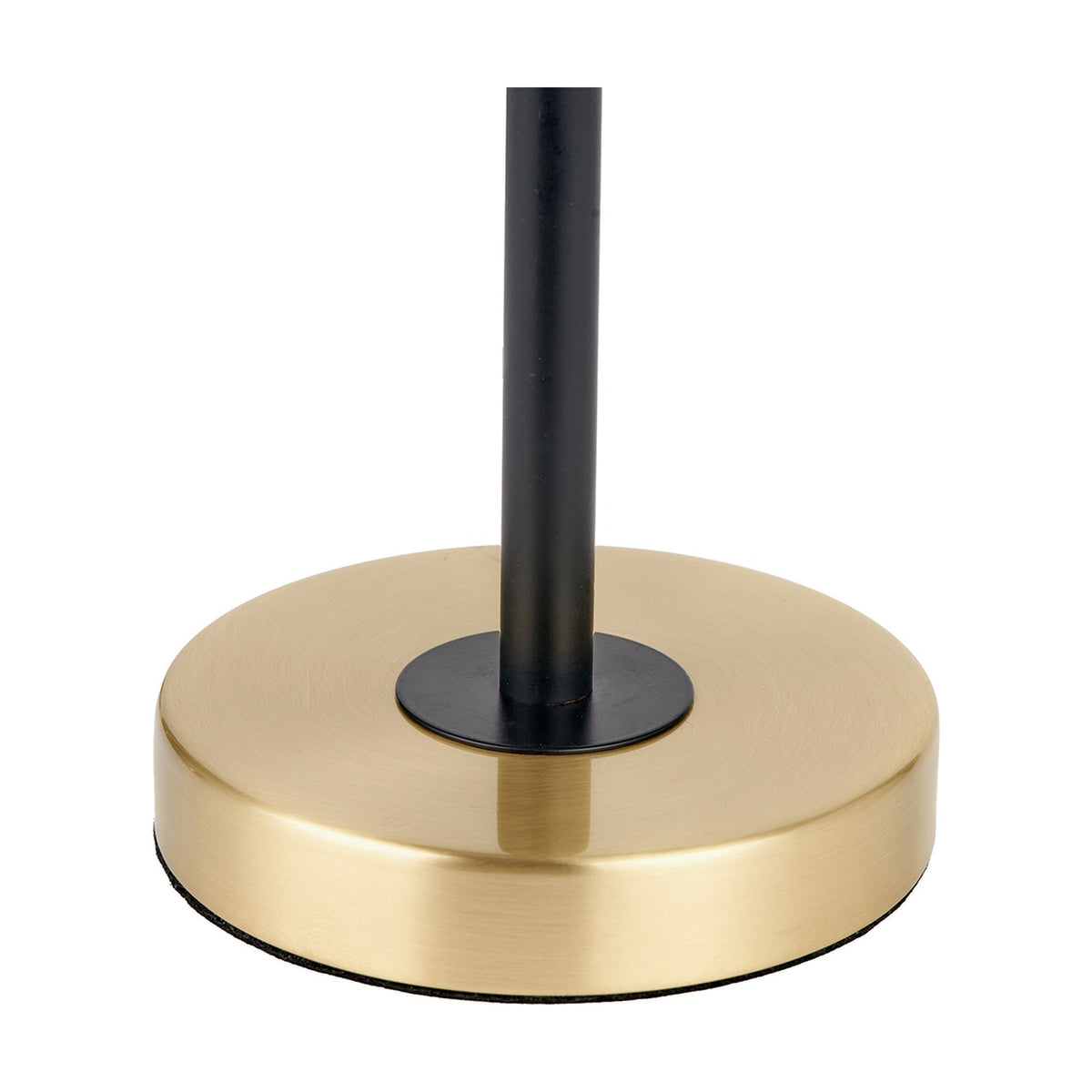 Close-up of the Bryce Black & Gold Iron Rise & Fall Table Lamp's circular brushed gold base with a black metal rod stem, shown on a plain white background.