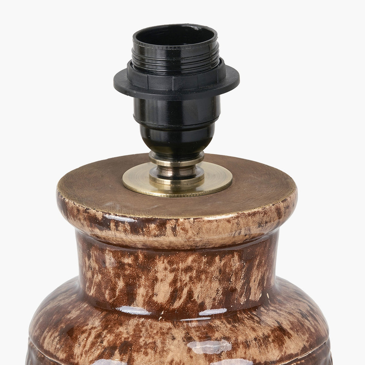 Close-up of the Theano table lamp base in brown mottled glazed ceramic, showing the E14 bulb holder and antique brass gallery on a plain background.