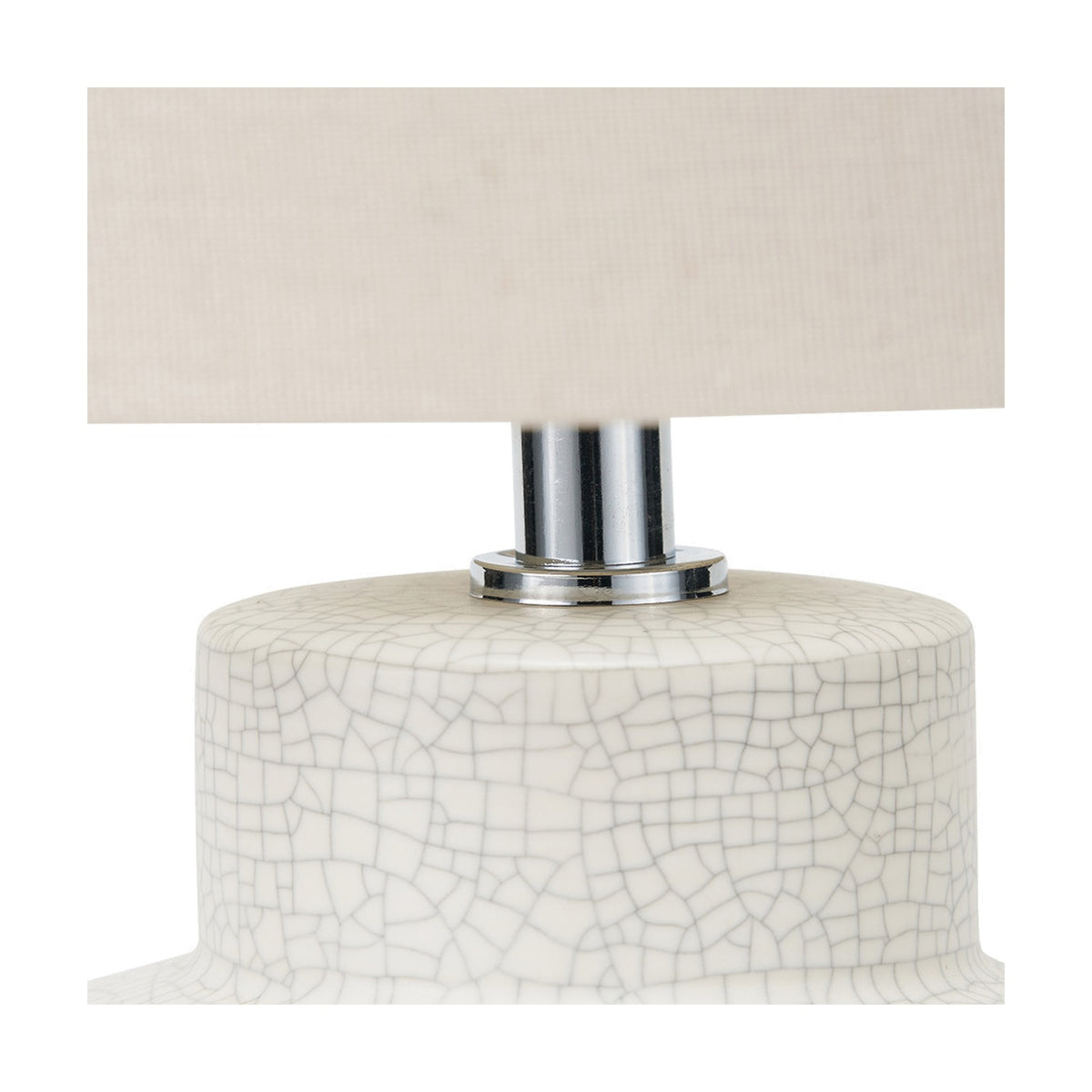 Close-up of the Elure White Crackle Effect Table Lamp's ceramic base with fine crackle glaze, chrome neck fitting, and beige rectangular shade against a plain white background.