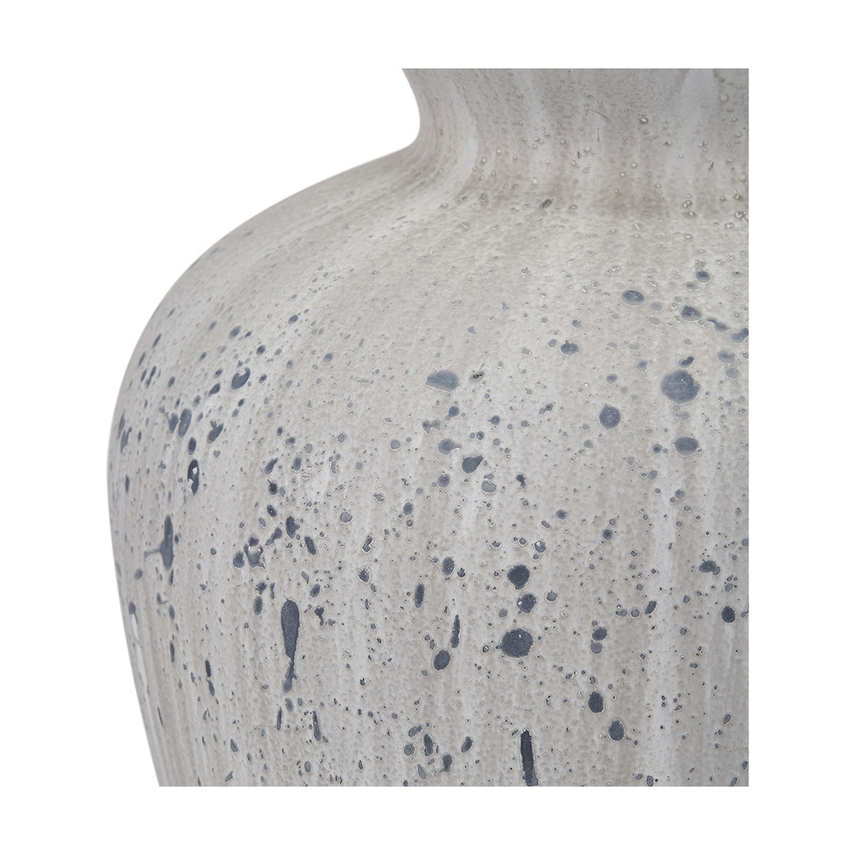 Close-up of the Kalli White & Grey Flecked Ceramic Table Lamp base, showing a textured white ceramic surface with grey and black speckled detailing.