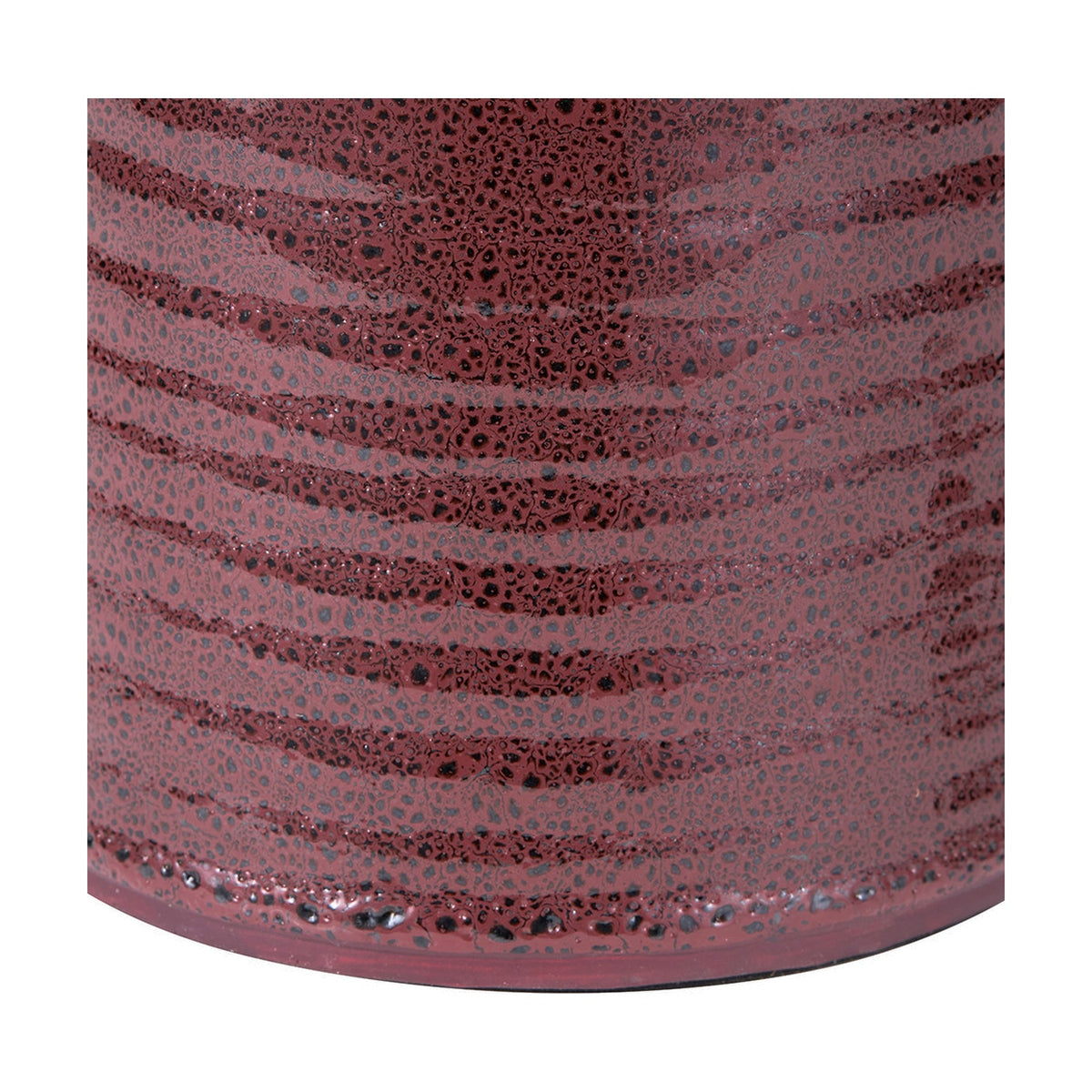 Close-up of the Helka Mulberry Red Reactive Glaze Table Lamp base, showing textured ceramic with a wavy ridged pattern in mulberry red and black speckled finish.