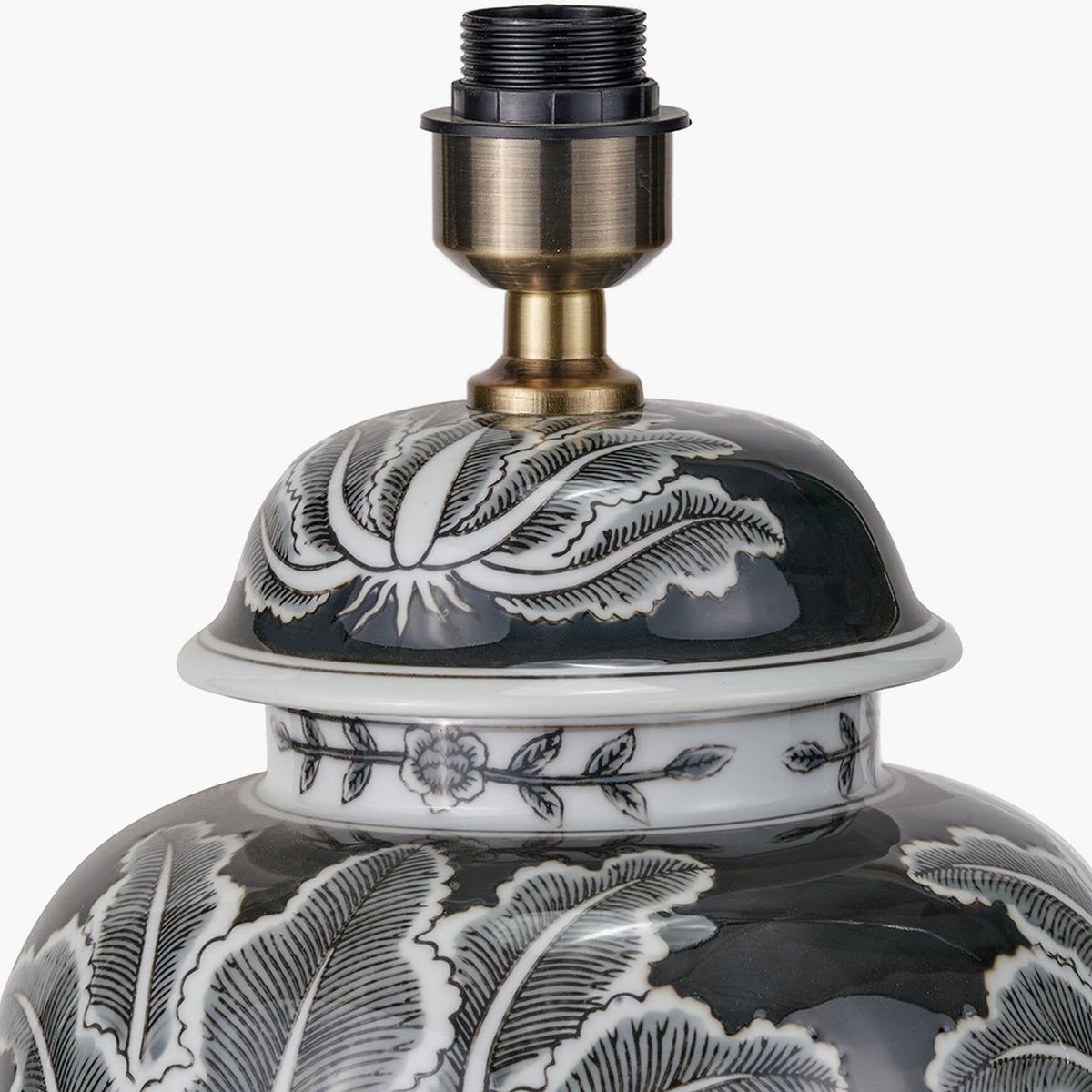 Close-up of the Black & White Feather Ceramic Urn Table Lamp Base, showing a domed urn top with feather motif and antique brass fitting on a white background.