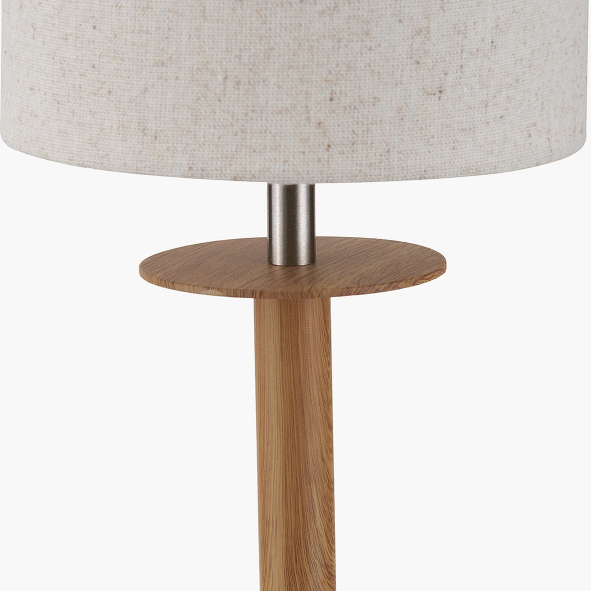 Bonham Table Lamp close-up showing wood veneer column, round wood disc support, and brushed silver metal neck beneath a natural linen drum shade.