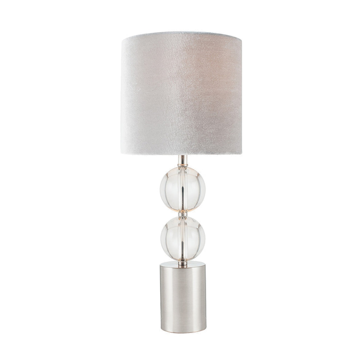 Harris table lamp with brushed silver cylindrical base, two stacked clear glass spheres, and a light grey velvet drum shade, shown on a plain white background.