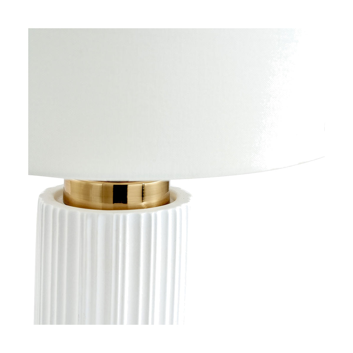 Close-up of the Ionic White Textured Ceramic & Gold Metal Table Lamp, showing the ribbed white ceramic base, gold metal collar, and white fabric drum shade.