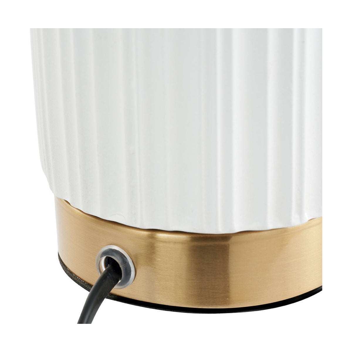 Close-up of the Ionic White Textured Ceramic & Gold Metal Table Lamp base, showing ridged white ceramic body, brushed gold band, and black cable exit.