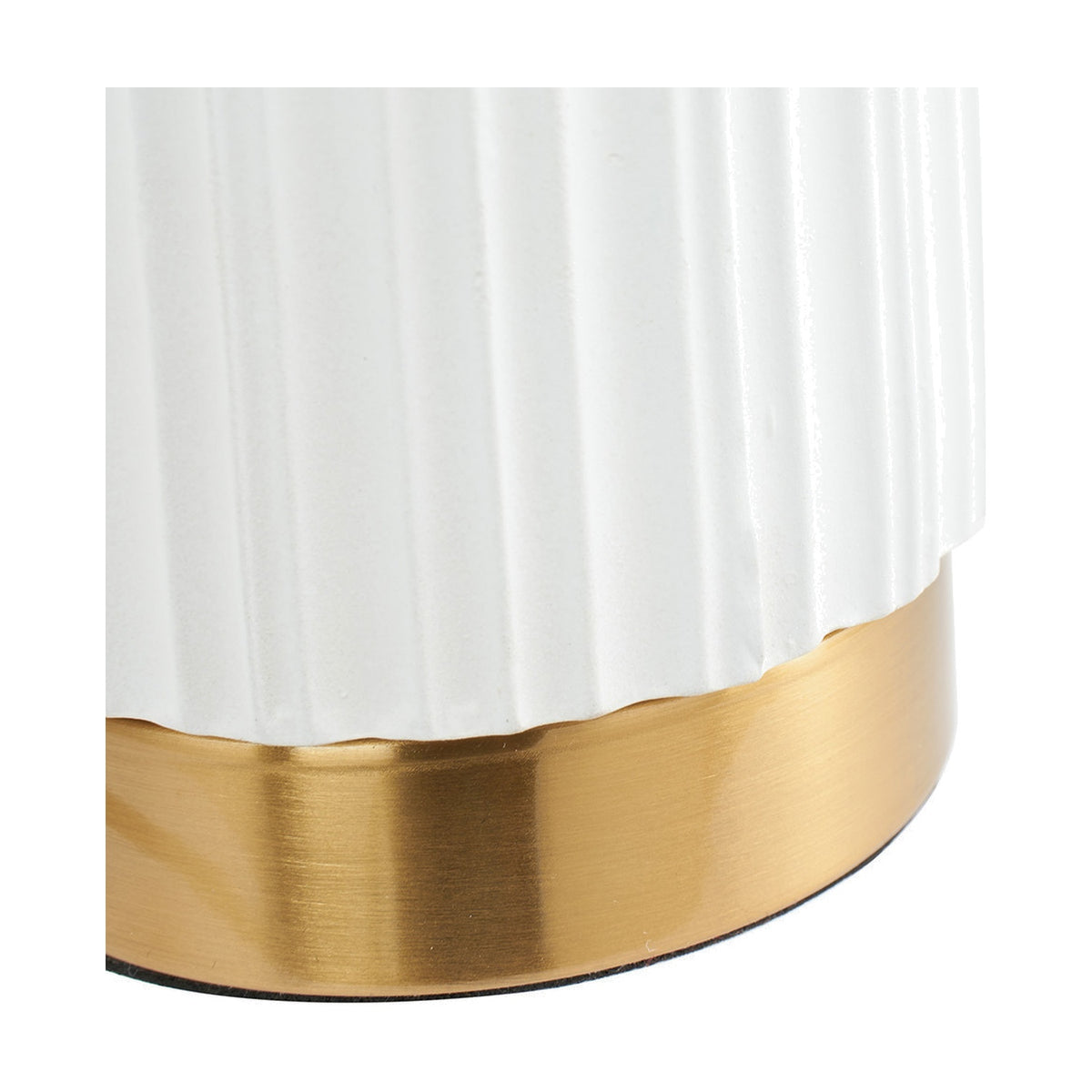 Close-up of the Ionic White Textured Ceramic & Gold Metal Table Lamp base, showing ribbed white ceramic texture meeting a brushed gold metal band on a plain white background.
