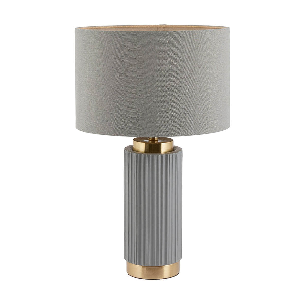 Ionic table lamp with a ribbed grey ceramic base, gold metal accents, and a grey drum fabric shade, shown on a plain white background.