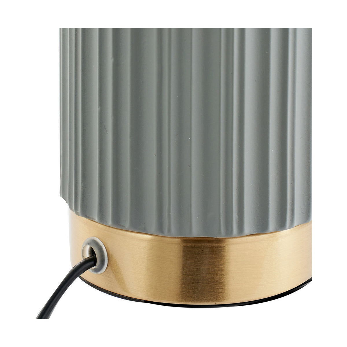Close-up of the Ionic Grey Textured Ceramic & Gold Metal Table Lamp base, showing ribbed grey ceramic detail, brushed gold trim, and cable outlet on a white background.
