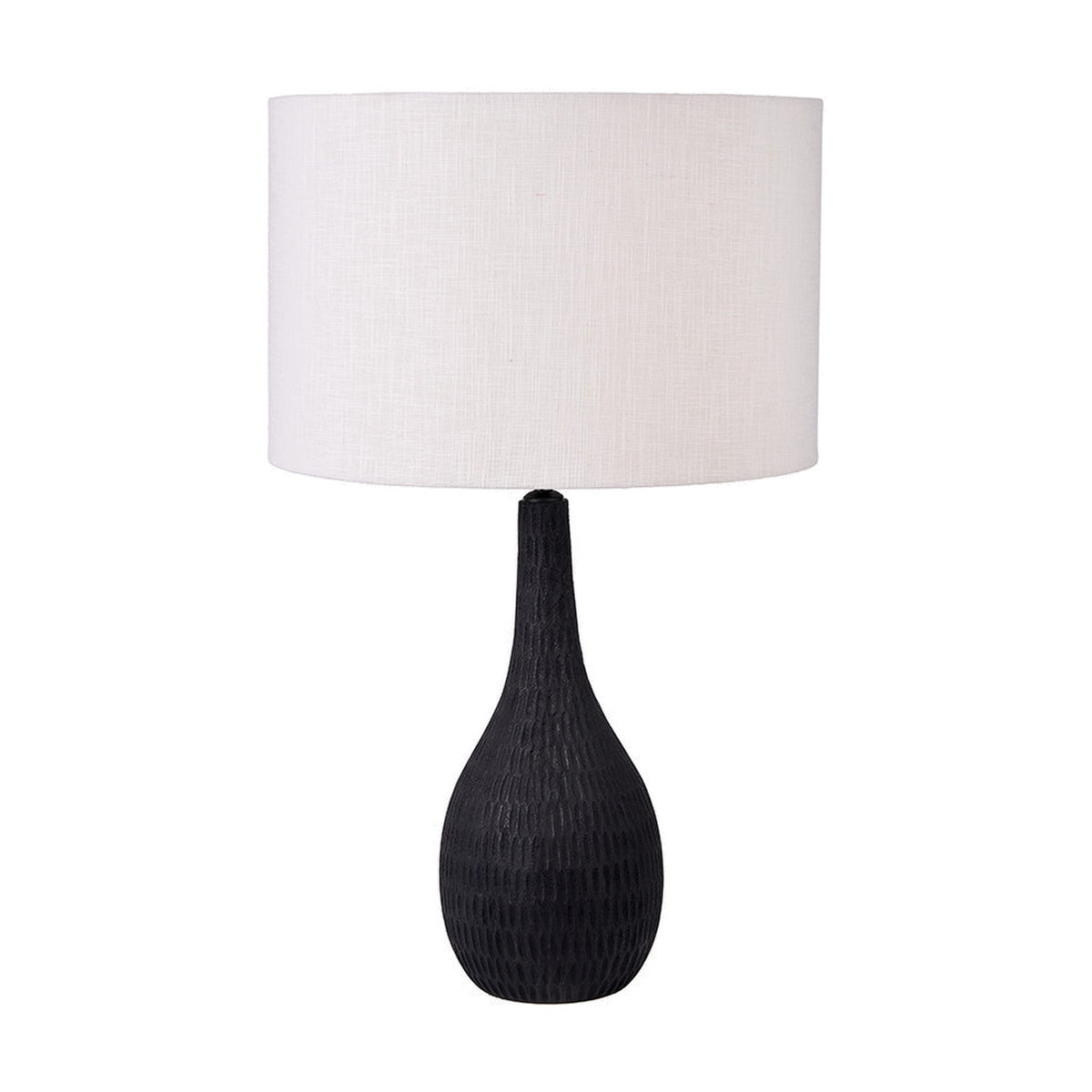 Ioan Black Engraved Wood Bottle Table Lamp Base, 49cm, with a bulbous carved base and drum-shaped white fabric shade, shown on a plain white background.