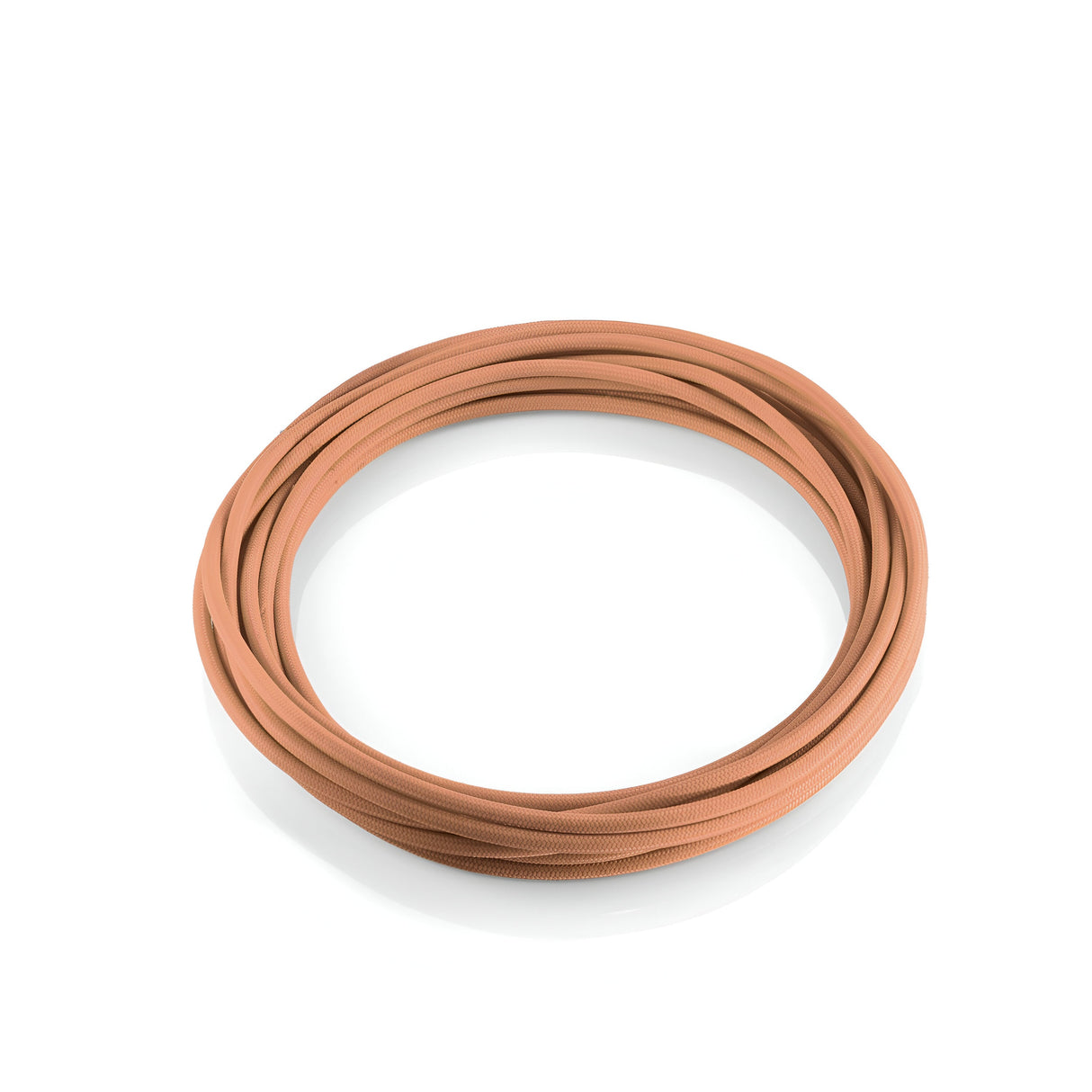 The Next Fabric Lighting Cable 5m in Copper is neatly coiled in a circle on a white background, resembling a durable hose.