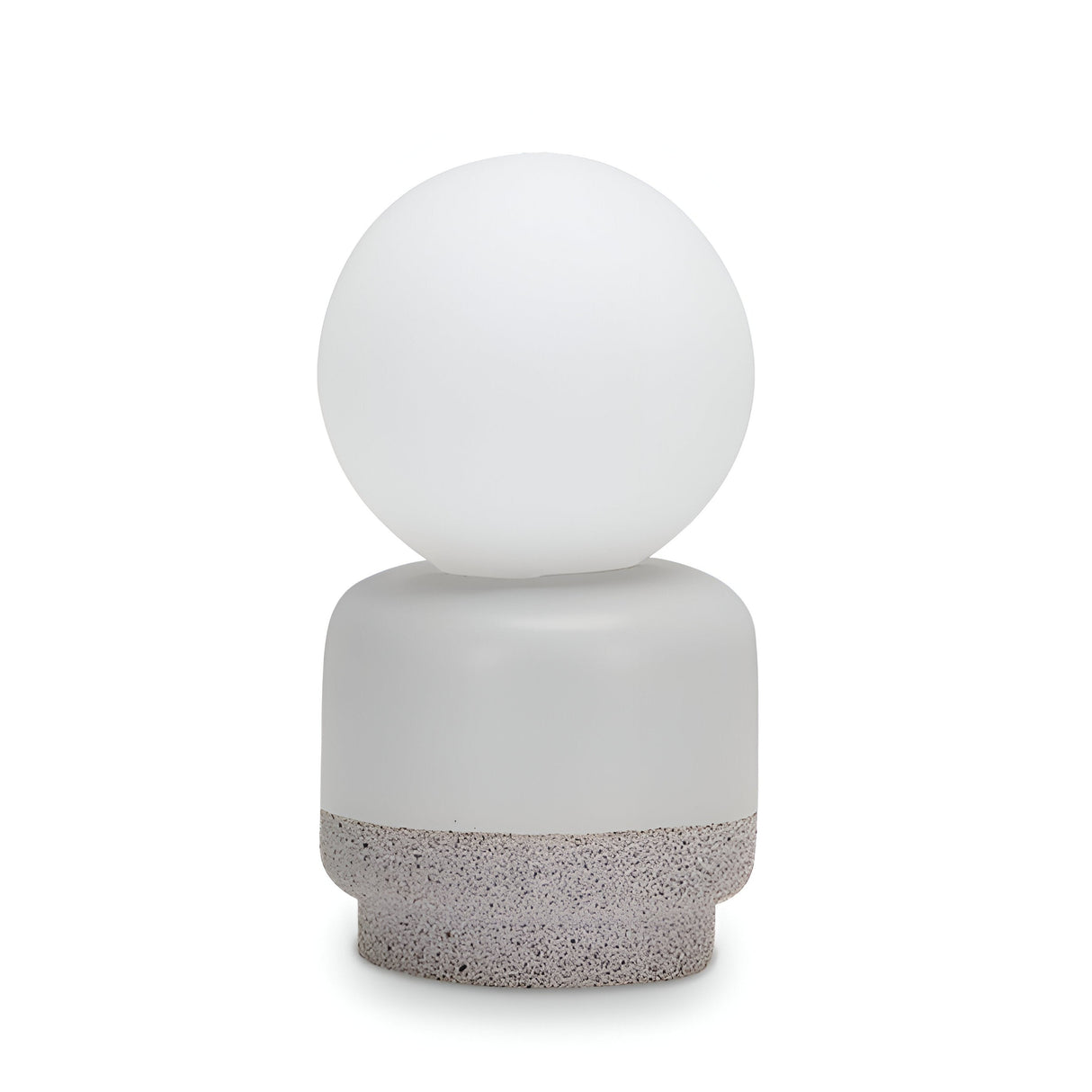 Introducing the Brillara Small Table Lamp - Grey, an industrial-style lighting piece characterized by its minimalist design. It boasts a round, white frosted glass shade that sits elegantly on a cement base, providing accent lighting while standing isolated against a clean white background.