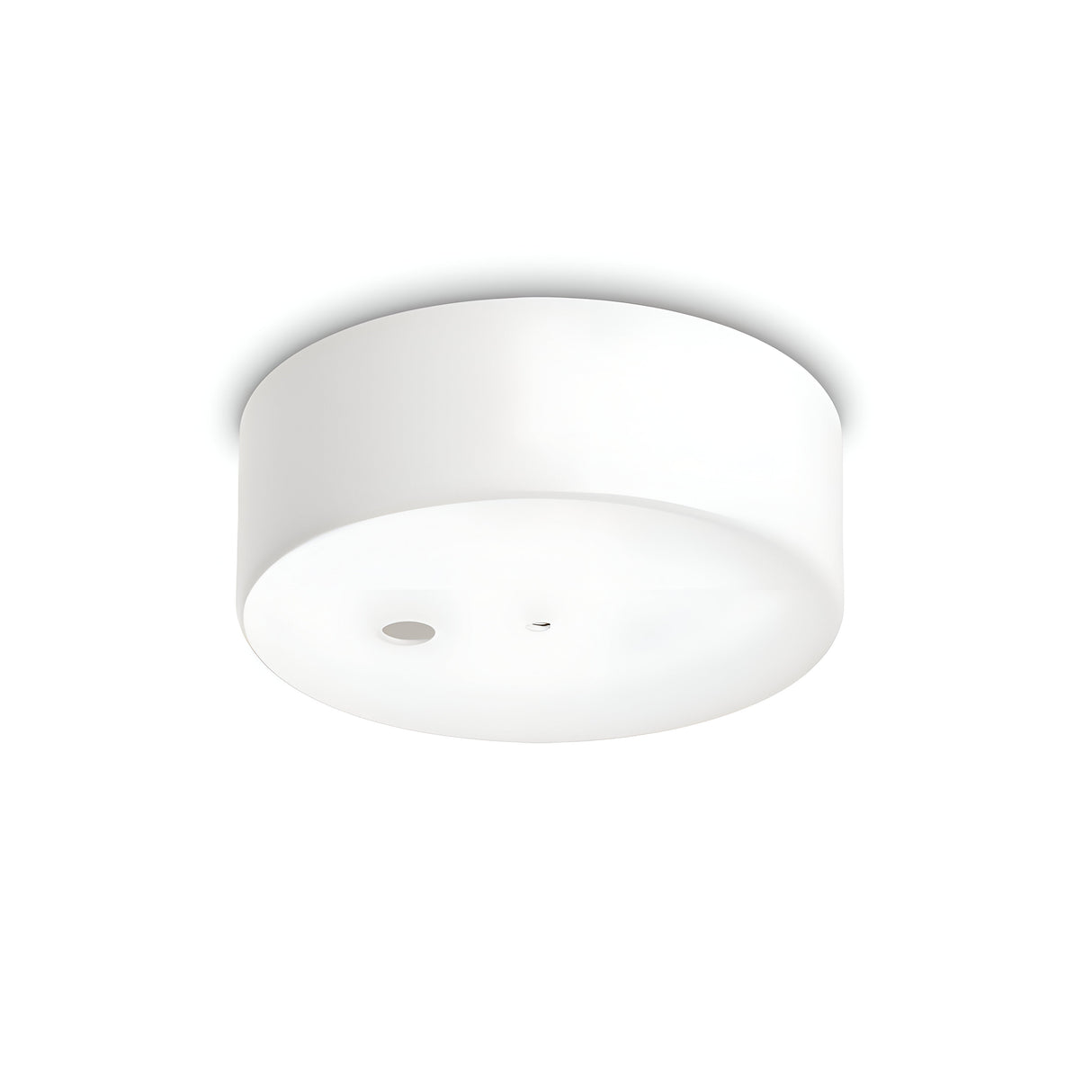 Introducing the Glacia 1 Light Magnetic Ceiling Rose in White: a sleek, circular ceiling fixture with a minimalist design and sturdy metal construction. It showcases one prominent round sensor on its bottom surface, allowing for a seamless mounting on flat, white ceilings while harmonizing effortlessly with modern minimalist lighting styles.
