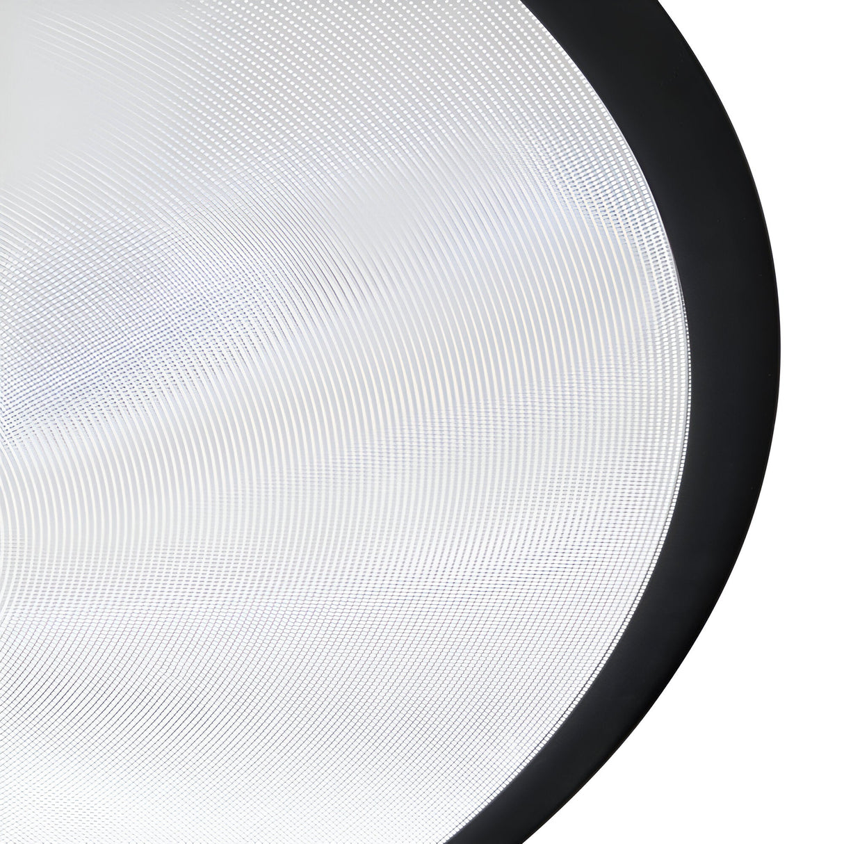 This detailed view showcases the circular, textured surface of the Luxra LED Suspension Light 61W 3000K - Black, 93cm. Concentric lines subtly interact with a thick black border, reminiscent of ridged glass or a light diffuser. The design beautifully captures modern aesthetics and ambient lighting by artfully manipulating light and shadow across its surface.