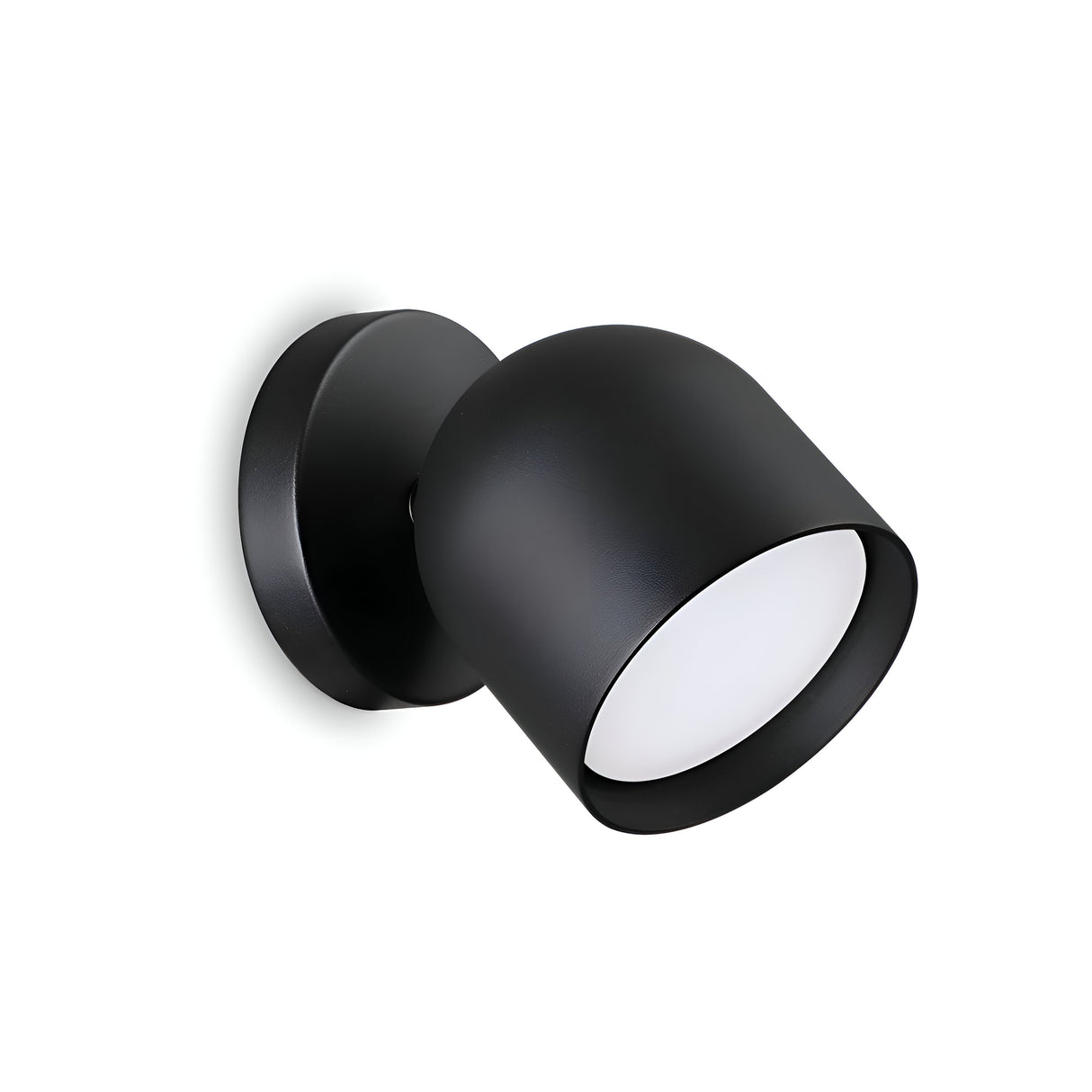 The Fable LED Single Spotlight - Black is a sleek wall-mounted light fixture with a cylindrical design and circular base, showcasing a minimalistic aesthetic against a white background.