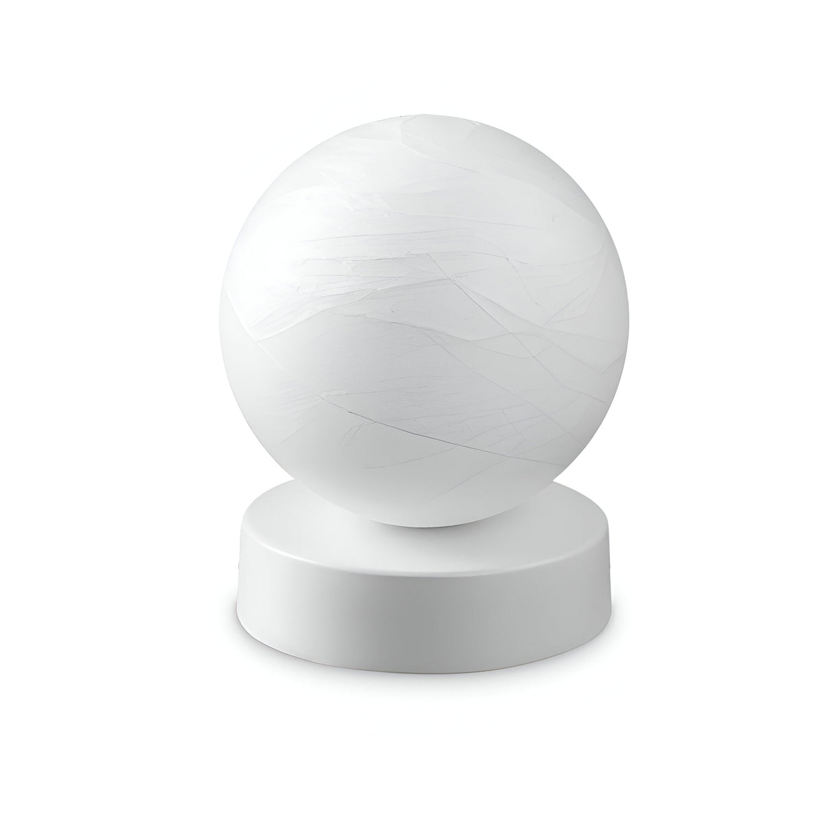 The Gleonis Small Table Lamp - White, 10cm, features a smooth, white sphere resting on a cylindrical white base against a plain backdrop, capturing the essence of minimalist design and contemporary décor. It’s an ideal addition to illuminate your space with understated elegance.
