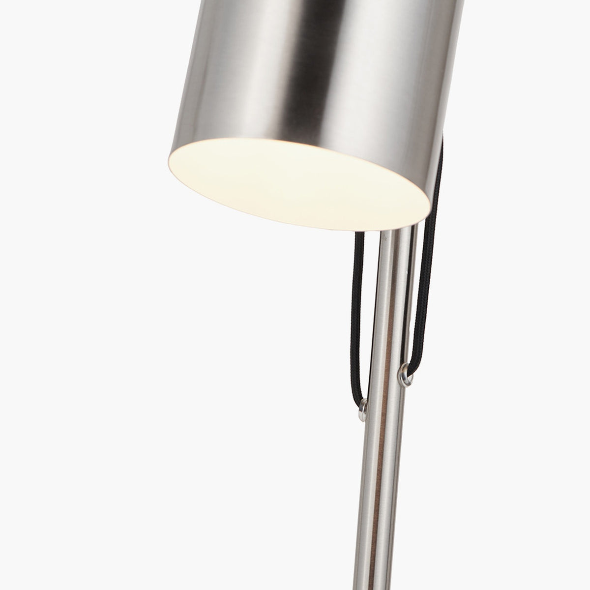 Close-up of the Aaron Brushed Chrome Silver Task Floor Lamp's cylindrical metal shade and adjustable neck with black cord detailing, set against a plain white background.