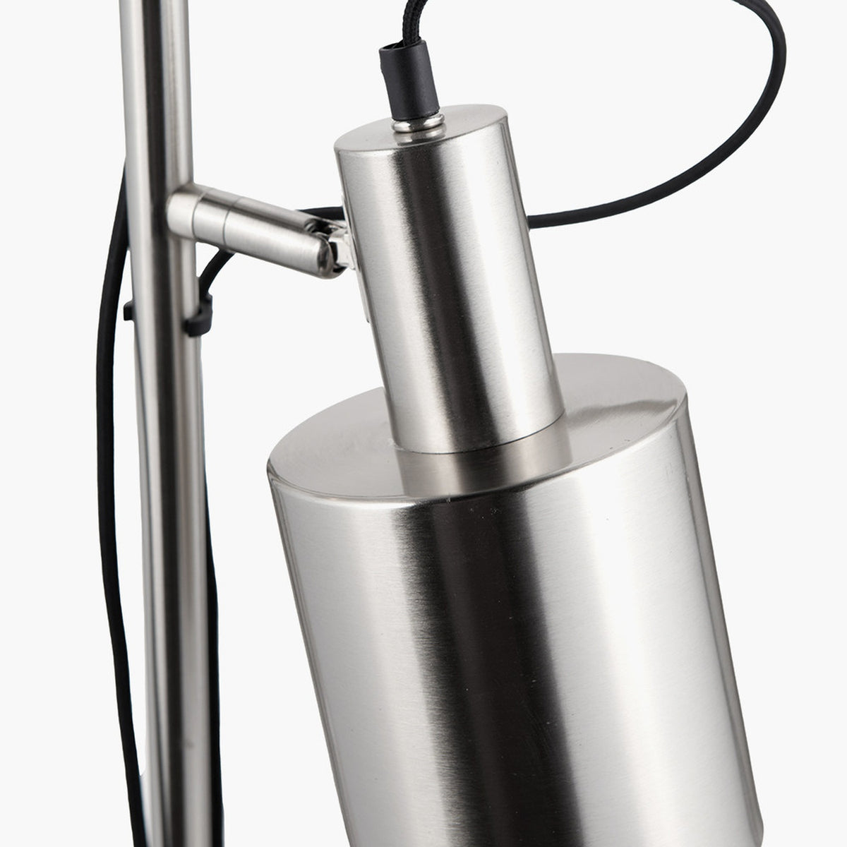 Close-up of the Aaron Brushed Chrome Silver Task Floor Lamp's adjustable cylindrical head and pivot joint, with black cable, against a plain white background.