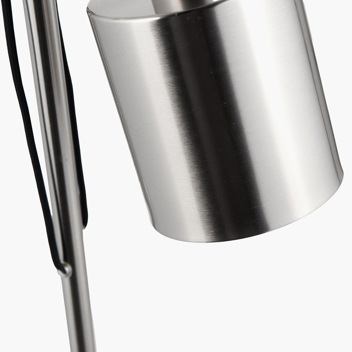 Close-up of the Aaron Task Floor Lamp's cylindrical shade in brushed chrome silver, showing the adjustable metal arm and hinge joint against a plain white background.