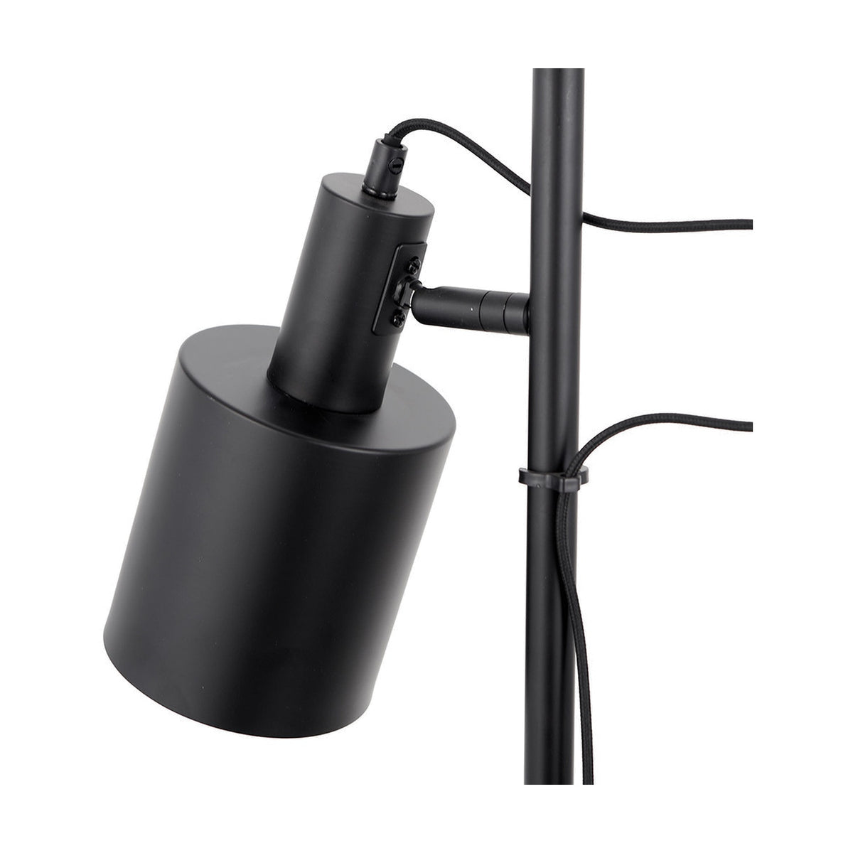Close-up of the Aaron Black Iron Task Floor Lamp's adjustable head and pole joint in matte black metal, with visible cable and pole clip, against a plain white background.
