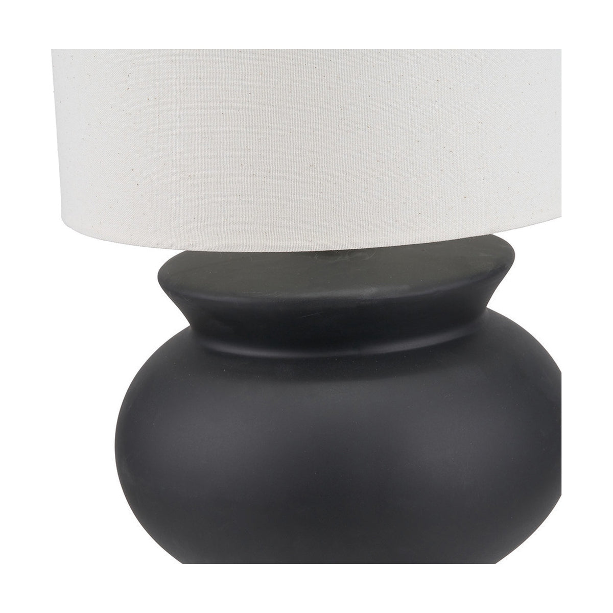 Close-up of the Sloane Black Contemporary Ceramic Floor Lamp's bulbous matte black ceramic base and neck, paired with a white fabric drum shade.