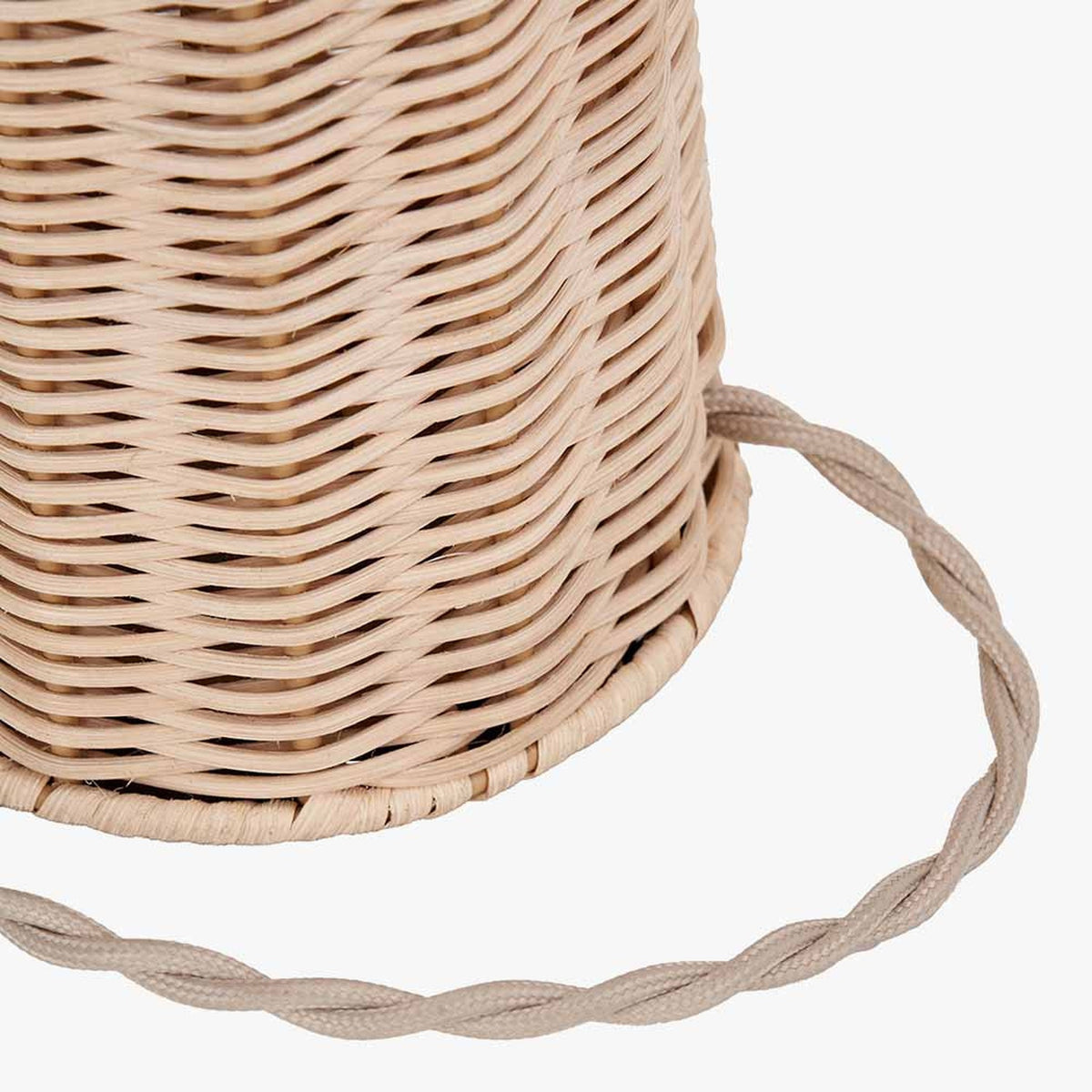 Close-up of the Hali Rattan Base & Shade Floor Lamp base, showing woven natural rattan texture and a twisted fabric flex cord, on a plain white background.