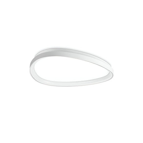 The Zephra LED Ceiling Light 42W 3000K in White, with its sleek oval shape and layered design, casts a soft glow. This energy-efficient fixture is mounted on a plain white ceiling, making it an ideal blend of style and sustainability in modern design.
