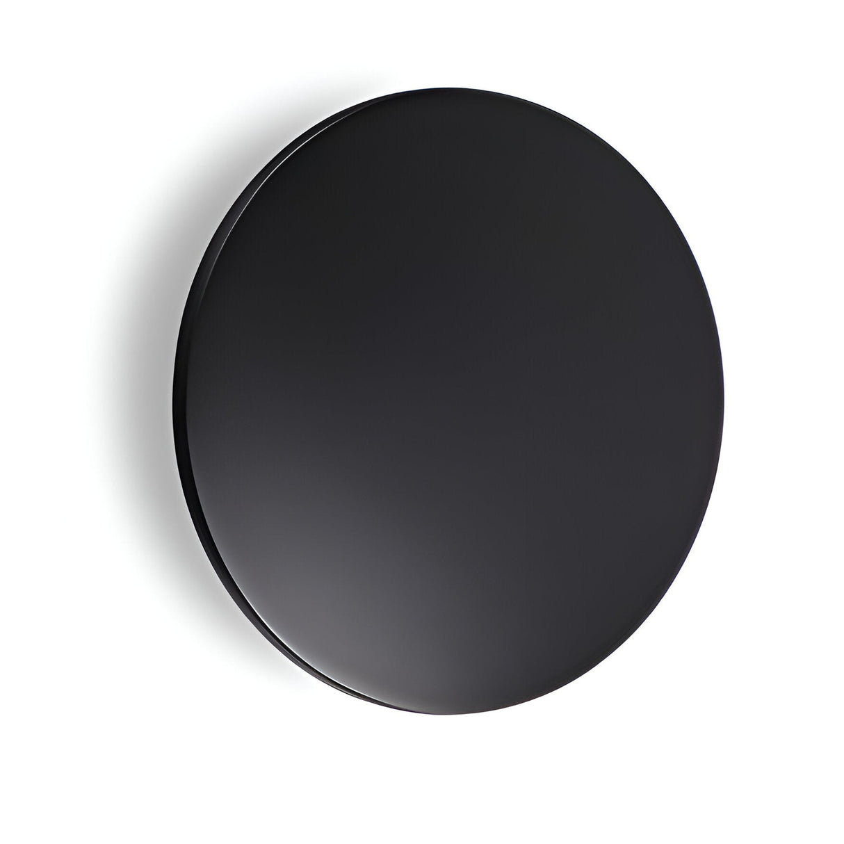 A large, smooth, circular black disc set against a white background describes the Eclipseax Outdoor LED Wall Light 12W 3000K - Black, 24cm. Its glossy surface subtly reflects light, suggesting its IP54 rating and impressive energy efficiency.