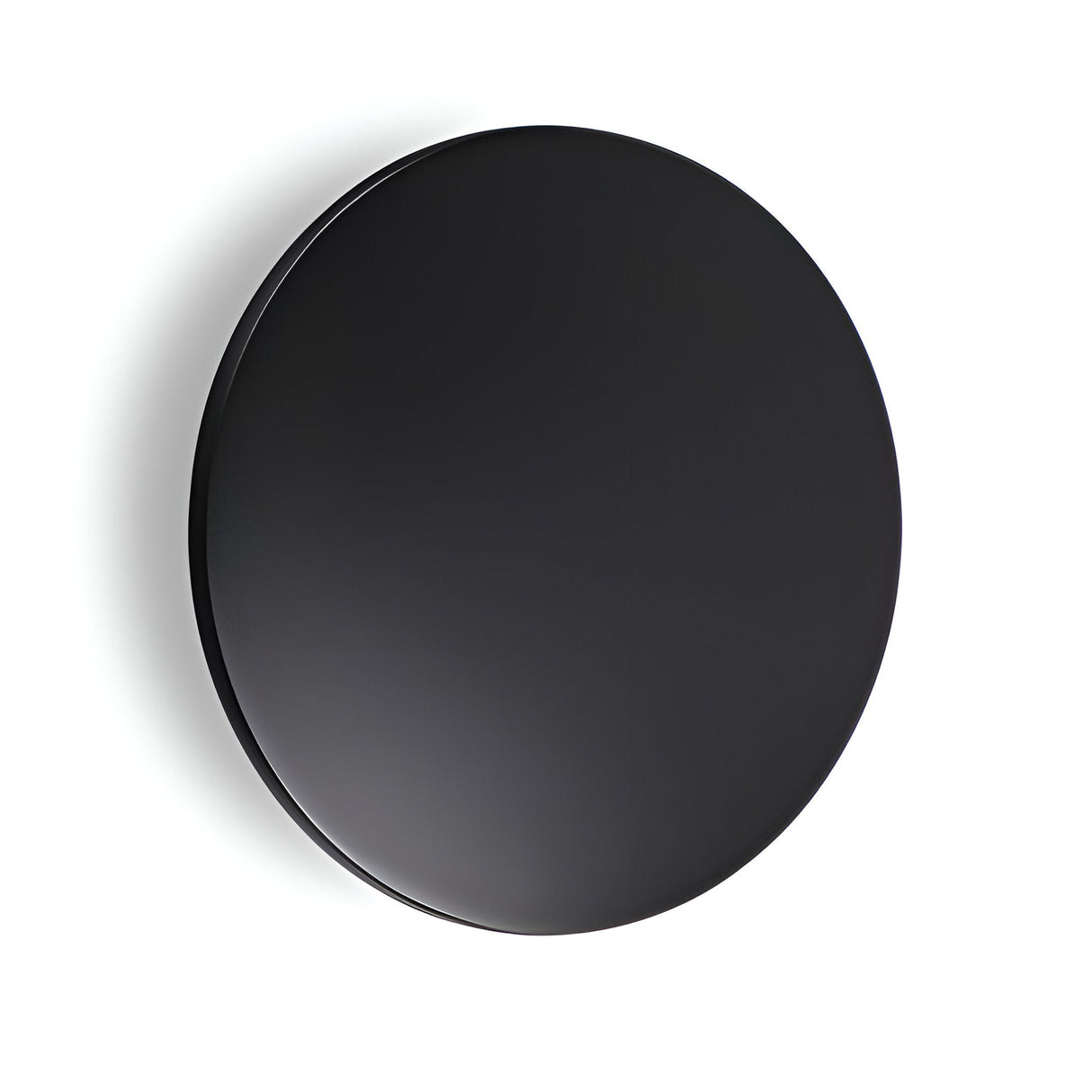 The Eclipseax Outdoor LED Wall Light 16W 3000K - Black, 30cm is a sleek, round black disc set against a white background. It features an IP54 rating and casts a subtle shadow to the left with its smooth, matte surface that exudes modern minimalism while providing a warm 3000K color temperature glow.