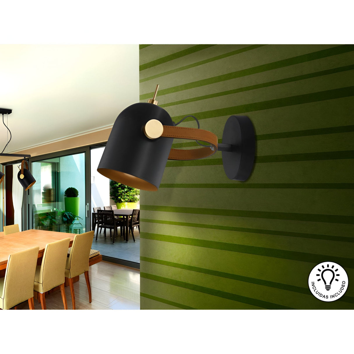 The Adame Single Revolving Spotlight in black and brown is wall-mounted on a green striped dining room wall above a wooden table with beige chairs; a matching lamp appears in the background.