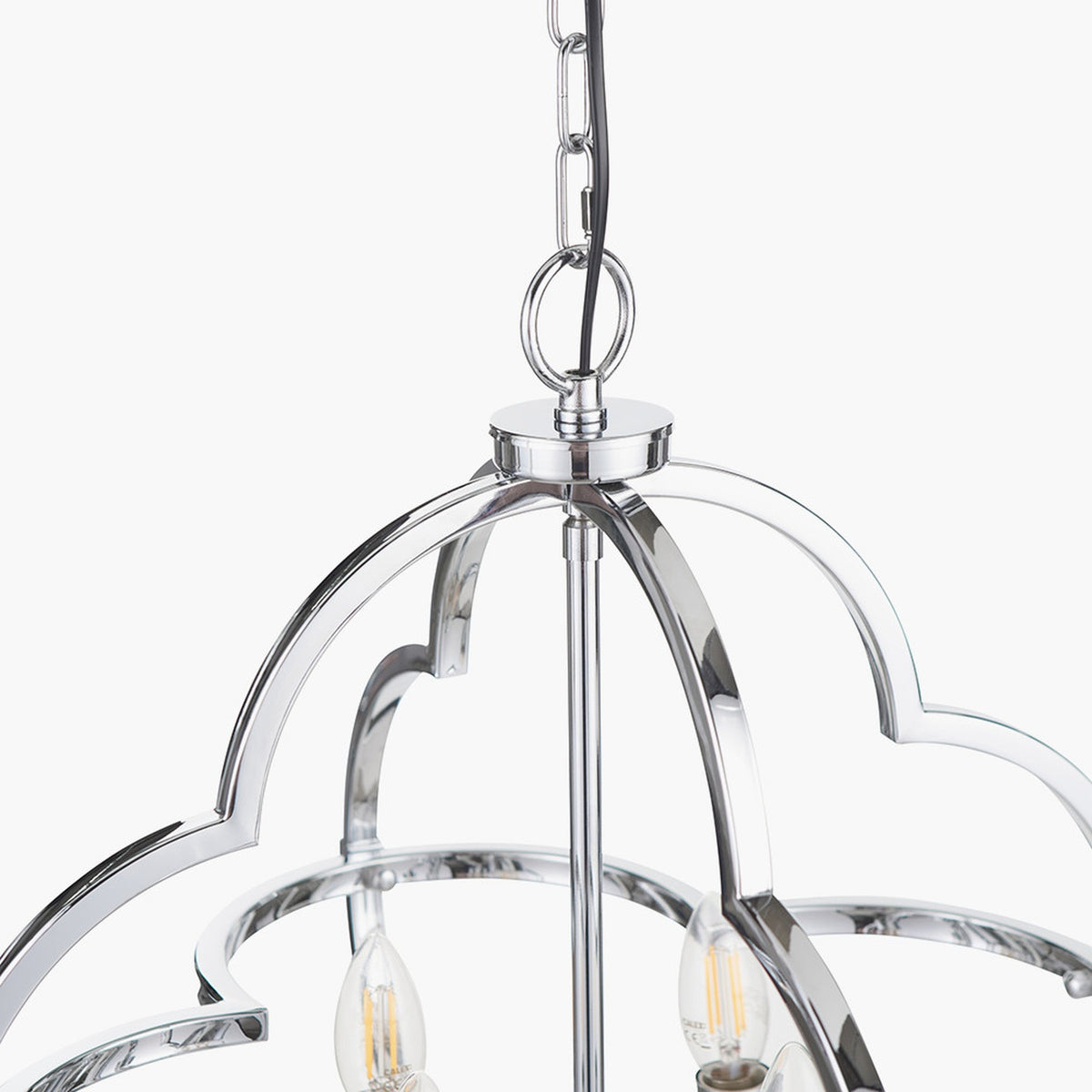 Close-up of the Amine Chrome 4 Light Fleur De Lys Pendant, showing the chrome ceiling canopy, chain link, and curved arched frame with candle-style bulbs, on a white background.