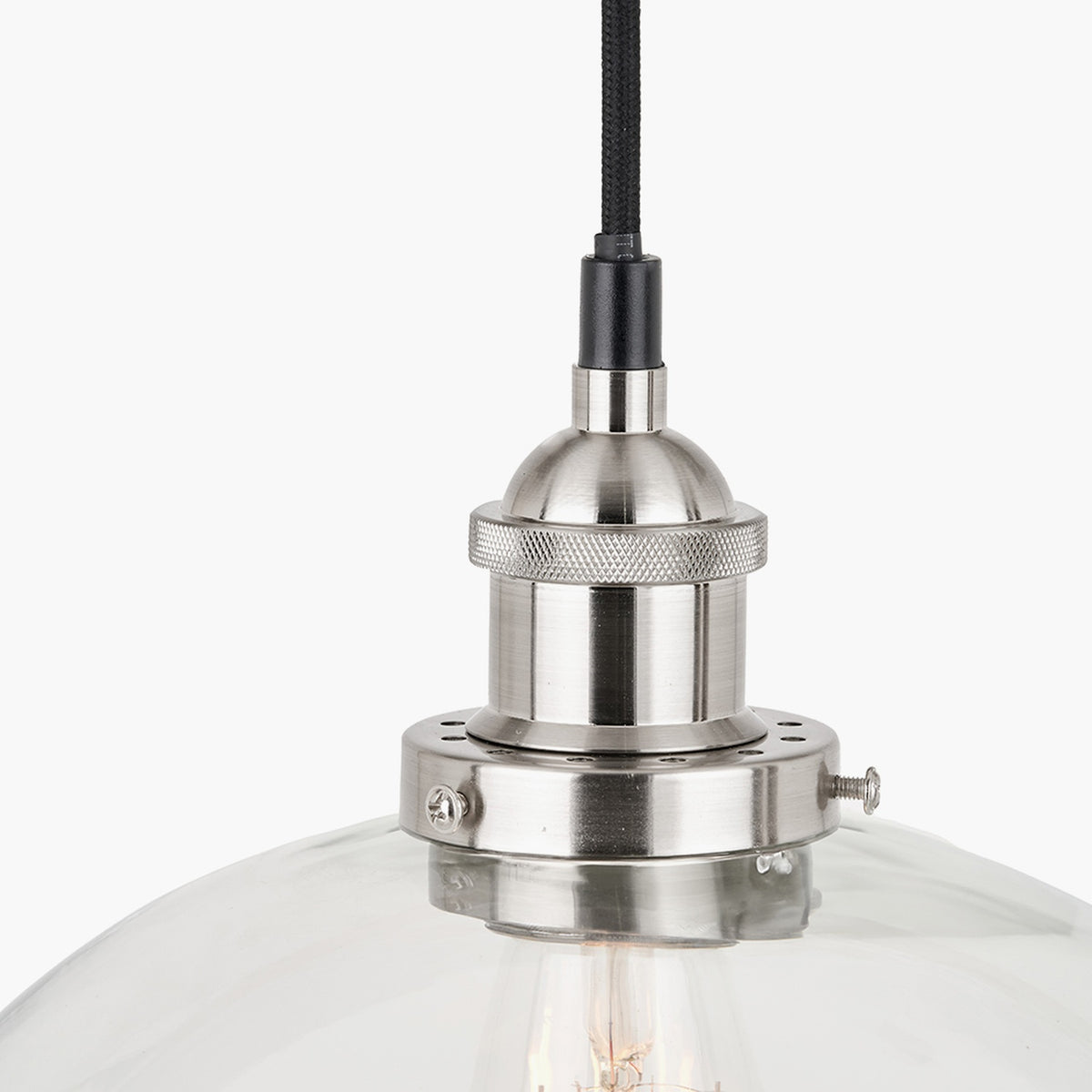 Cecilia dome pendant light in antique silver metal with clear glass shade, close-up of the knurled fitting and fabric cord against a plain white background.
