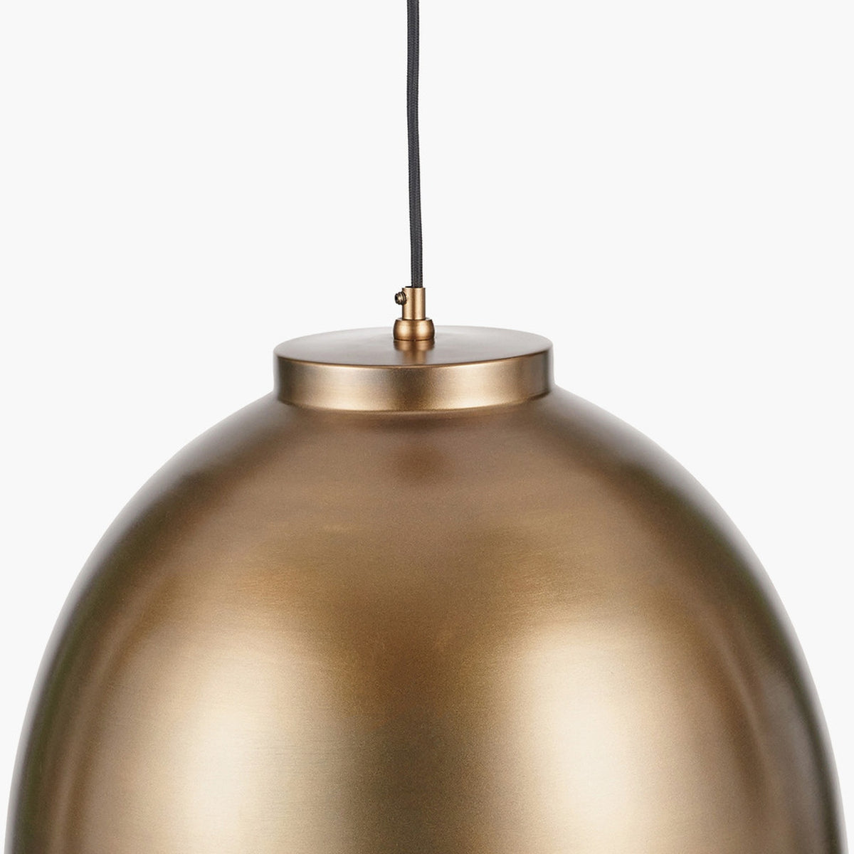 Close-up of the Harlem Antique Brass Domed Pendant Light, 45cm, showing its rounded metal shade and fabric-covered cord against a plain white background.