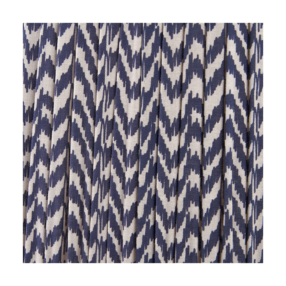 Close-up of the Vienna Blue Chevron Pleated Lampshade, 40cm, in pleated fabric with a blue and cream zigzag pattern.