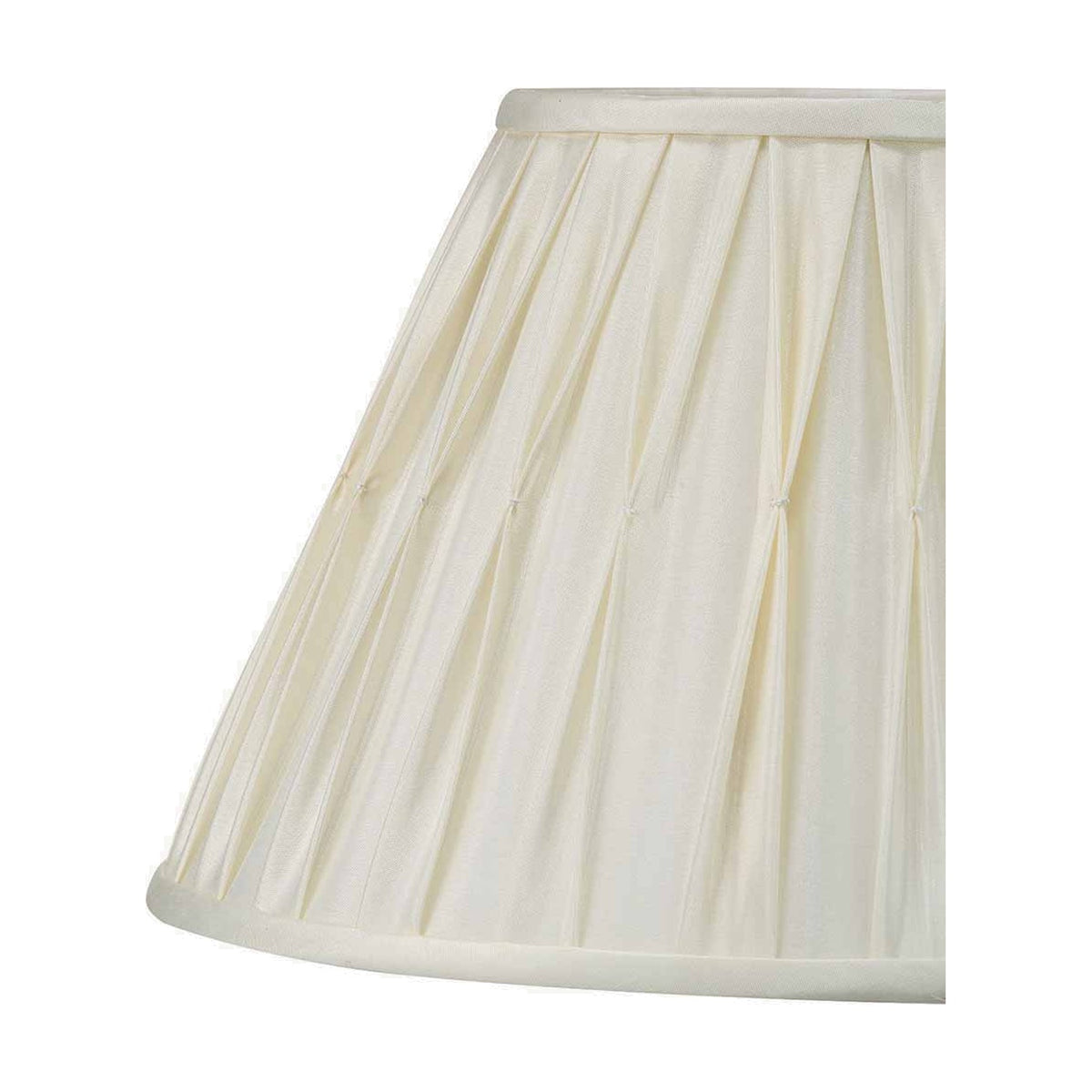 Close-up of the Garbo Cream Silk Mix Pinch Pleated Tapered Lampshade, 30cm, showing pleated fabric texture and trim on a plain white background.