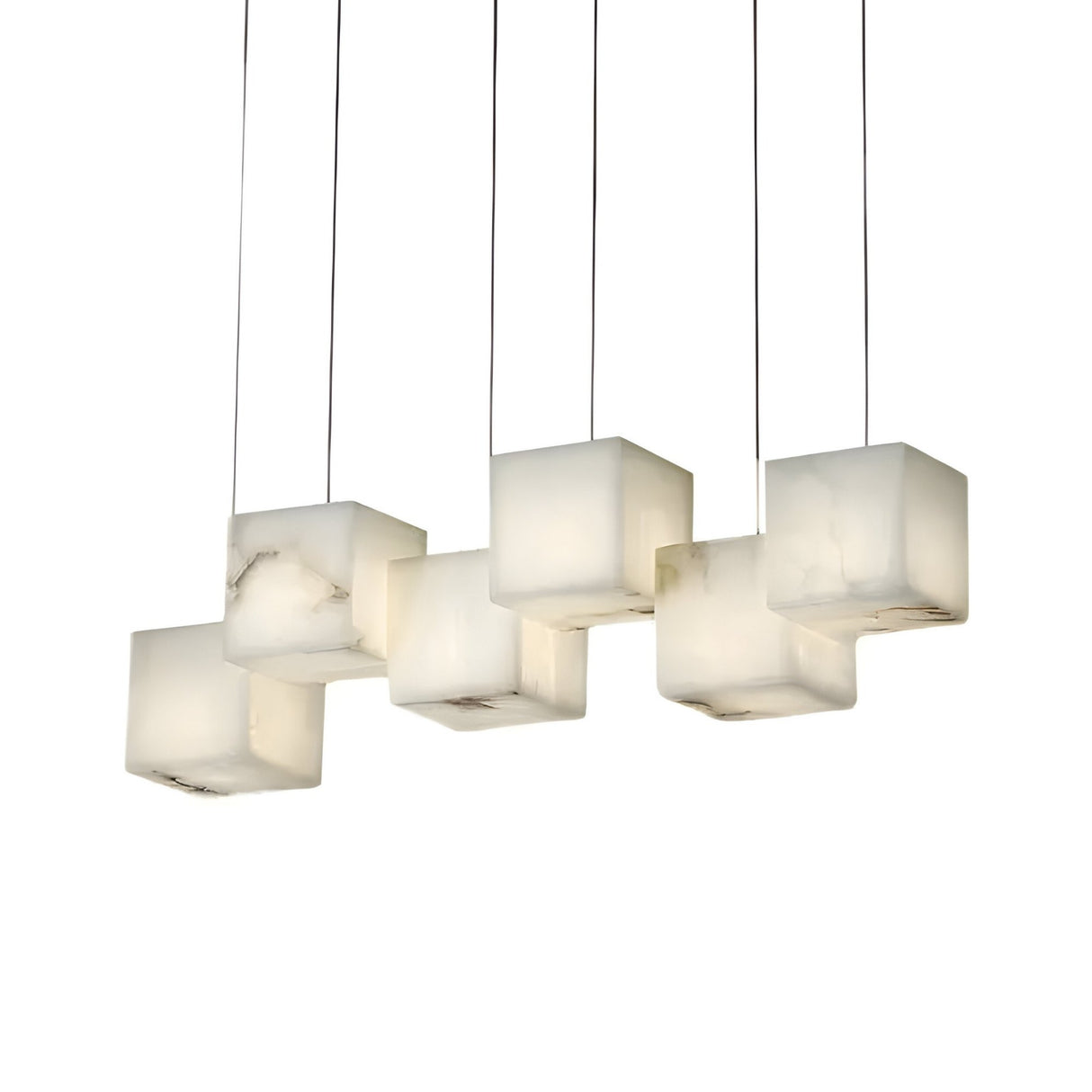The Elmyra 6 Light Linear Alabaster Bar Pendant Light in Soft White features six suspended, cube-shaped Spanish alabaster shades with natural marbling, offering soft, diffused illumination and a striking linear design.
