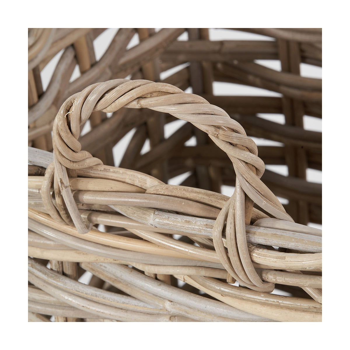 Close-up of the Tobs Kubu umbrella basket's woven rattan handle in grey, showing the twisted loop and cross-woven basket body.