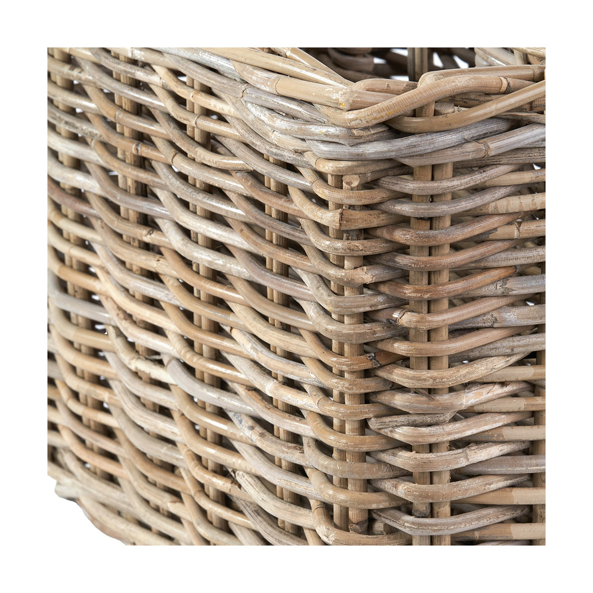 Close-up of the Tobs Grey Kubu Rattan Magazine Basket, 30cm, showing tightly woven rattan strands in natural and grey tones with a looped rim edge.