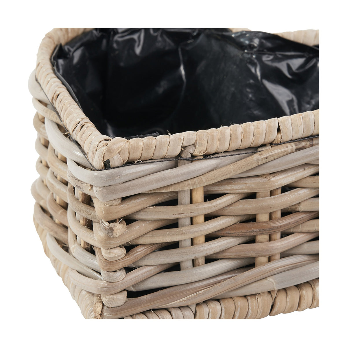 Close-up of the Tobs grey Kubu rattan basket planter, showing woven rattan sides, a whipped rim edge, and black plastic liner visible inside.