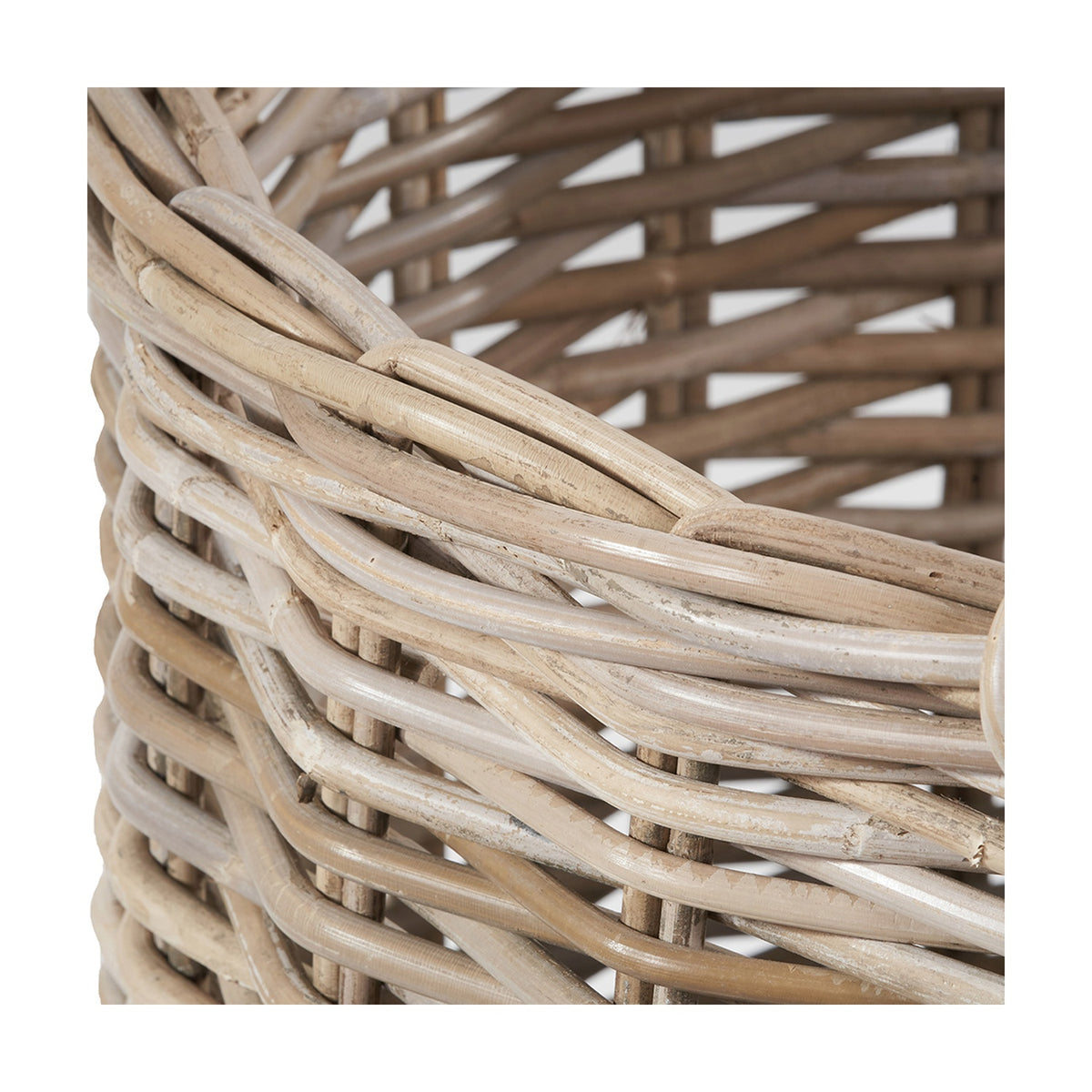 Close-up of the Tobs round log basket in grey rattan, showing the woven weave pattern and rim detail.