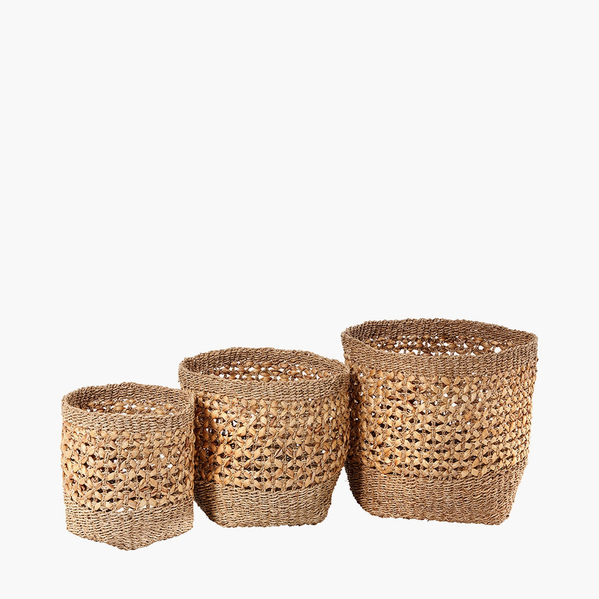 Set of 3 tall round storage baskets in natural seagrass and water hyacinth with open woven texture, graduated sizes, shown on a plain white background.