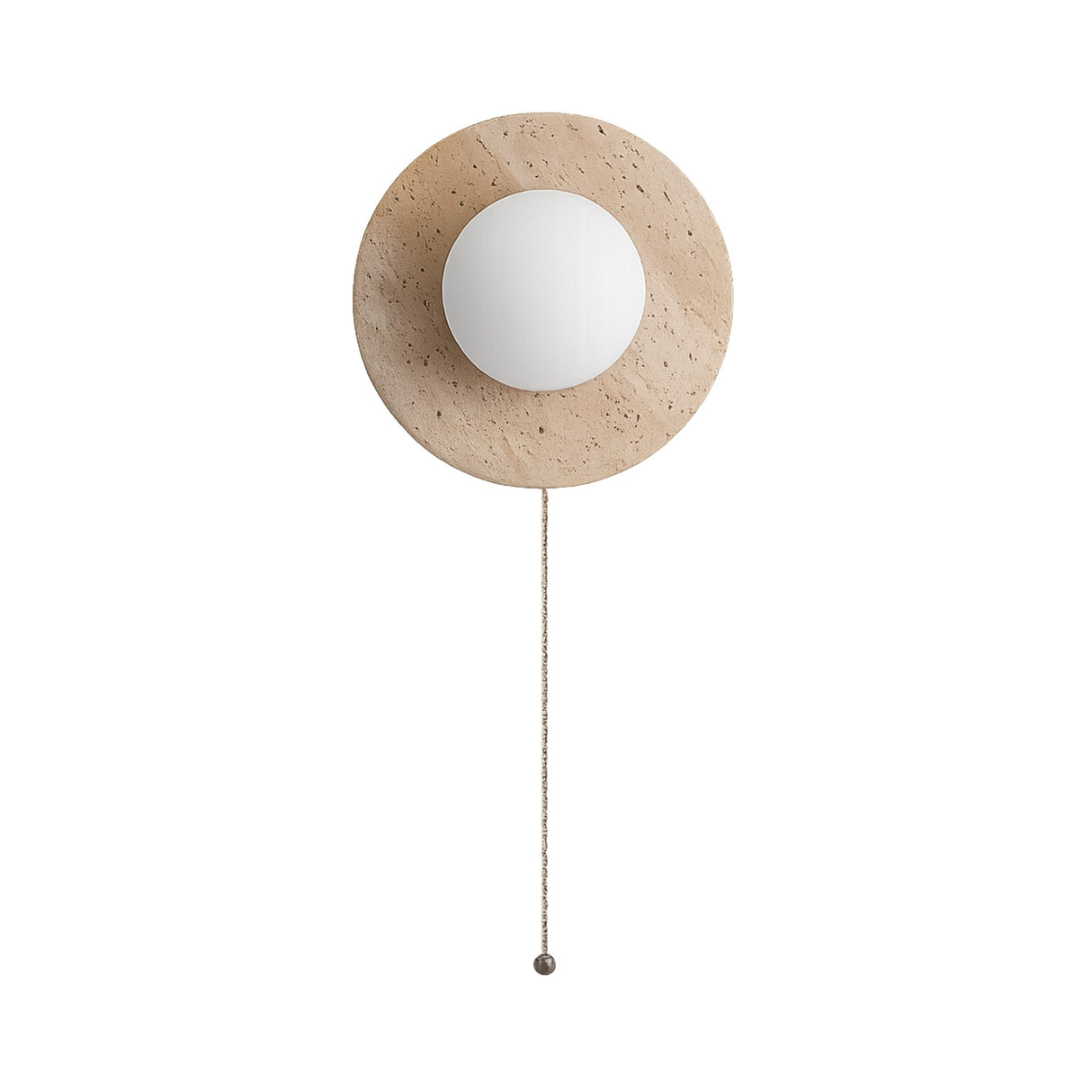 The Solenne 1 Light Travertine Wall Light With Pull Switch in light beige features a round stone backplate, central white globe, and pull chain—bringing modern elegance and ambient lighting to your space.