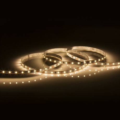 A 5-meter strip of 12V 4.8W LED lights in a warm white 3000K hue, configured in overlapping circles on a dark surface, emits a radiant and contemporary look with versatile design options.