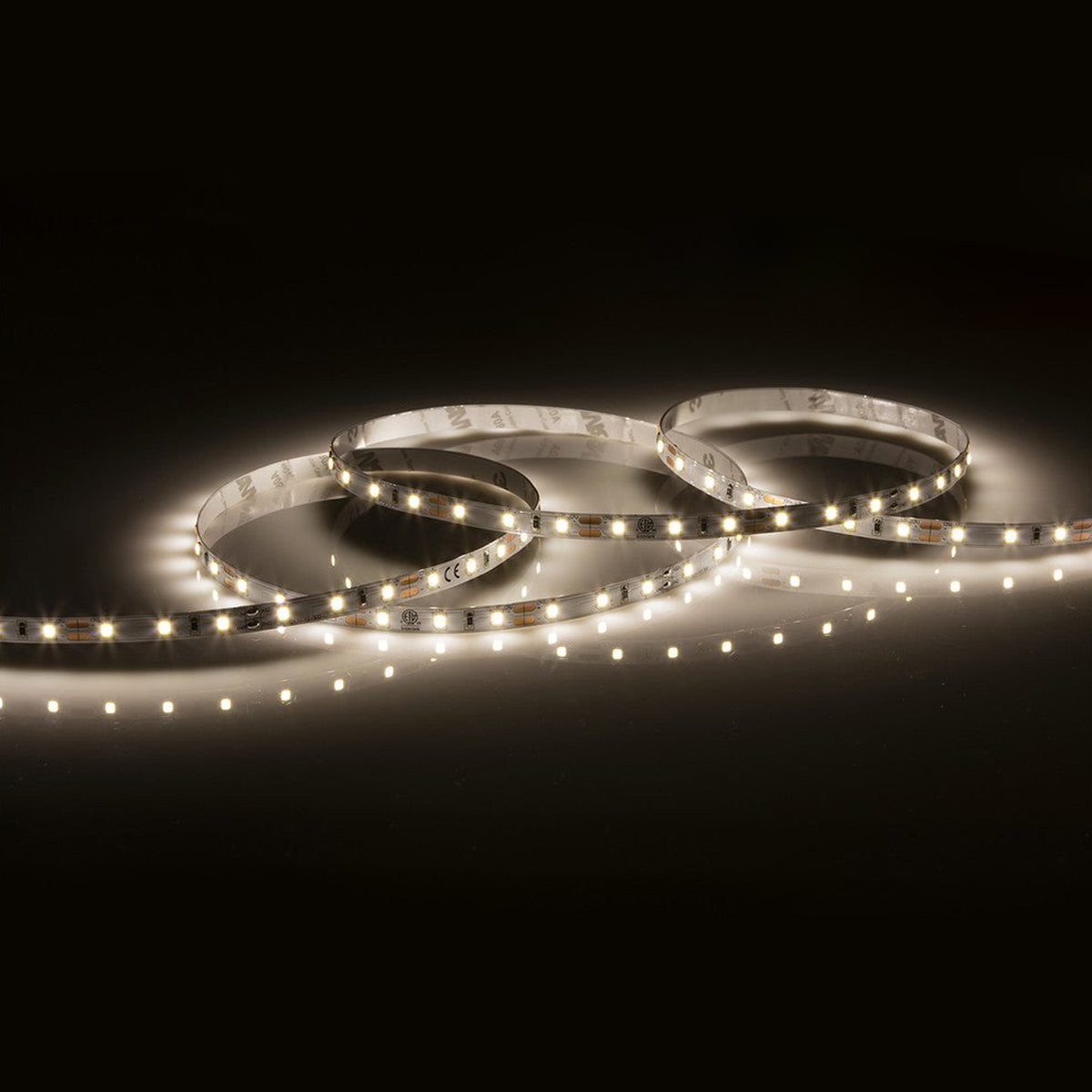 A coiled 12V 4.8W LED strip light, casting a cool white 4000K glow on a dark surface.
