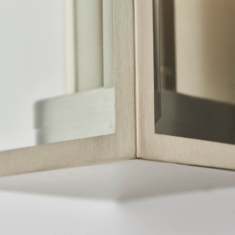 Close-up of Endon Castwick Lantern Wall Light in silver, showing the brushed steel corner frame and bevelled-edge clear glass panels.