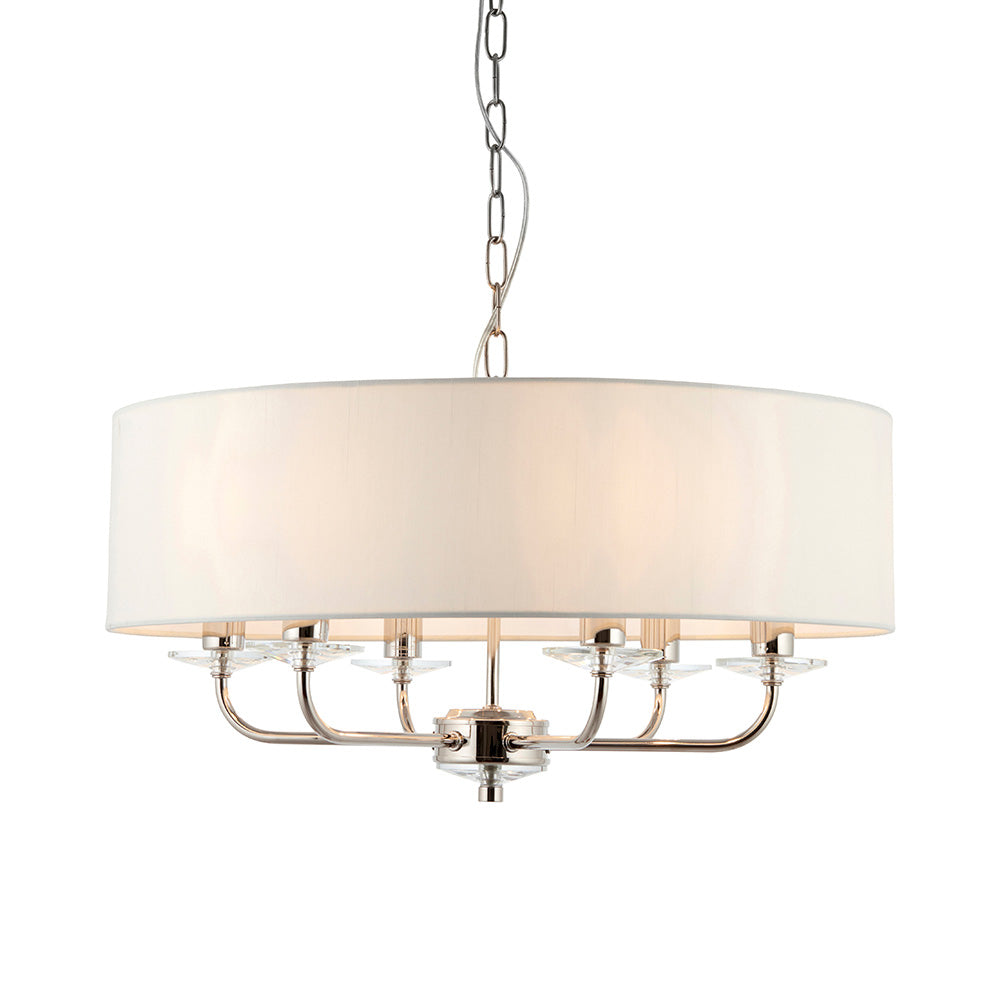 Castdon 6 Light Pendant in nickel with a large white drum shade, six curved arms, crystal accents and hanging chain, shown on a plain white background.