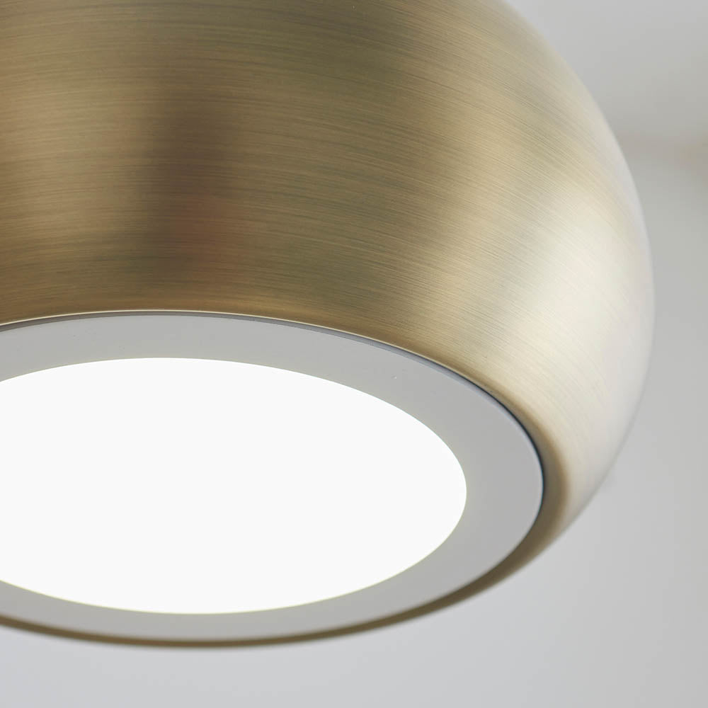 Close-up of Endon Ashleigh pendant light showing the brushed antique brass domed shade and integrated white LED diffuser underneath.