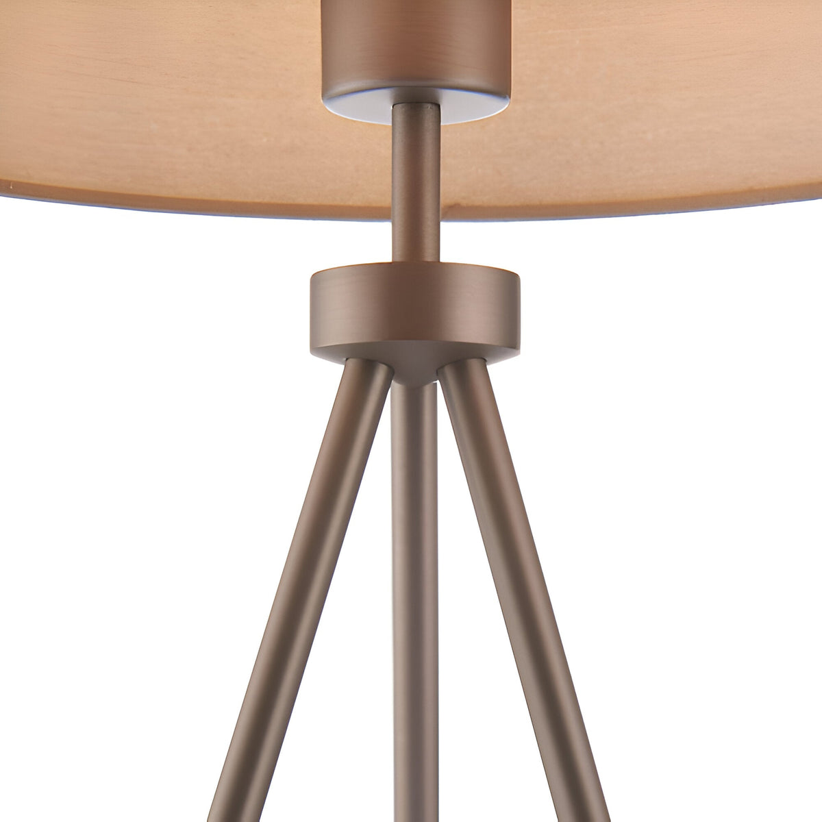 Close-up of the Endon Cranwell table lamp showing the matt nickel tripod legs meeting under a wide grey linen-effect fabric shade.