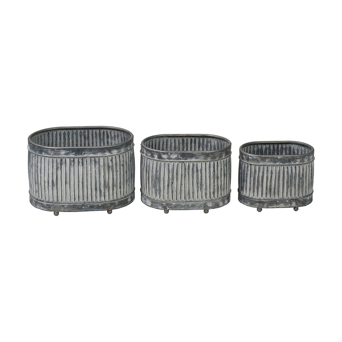 Set of three galvanised zinc oval planters in graduated sizes, each with ribbed metal sides and small feet, shown on a plain white background.